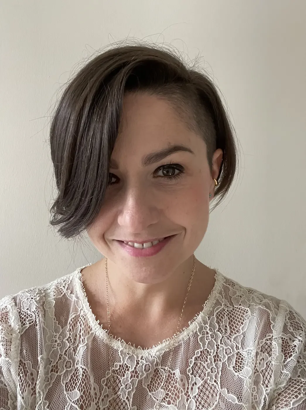 Portrait of Sophie Rowland yoga teacher at Meridian Yoga & Pilates, smiling in the studio