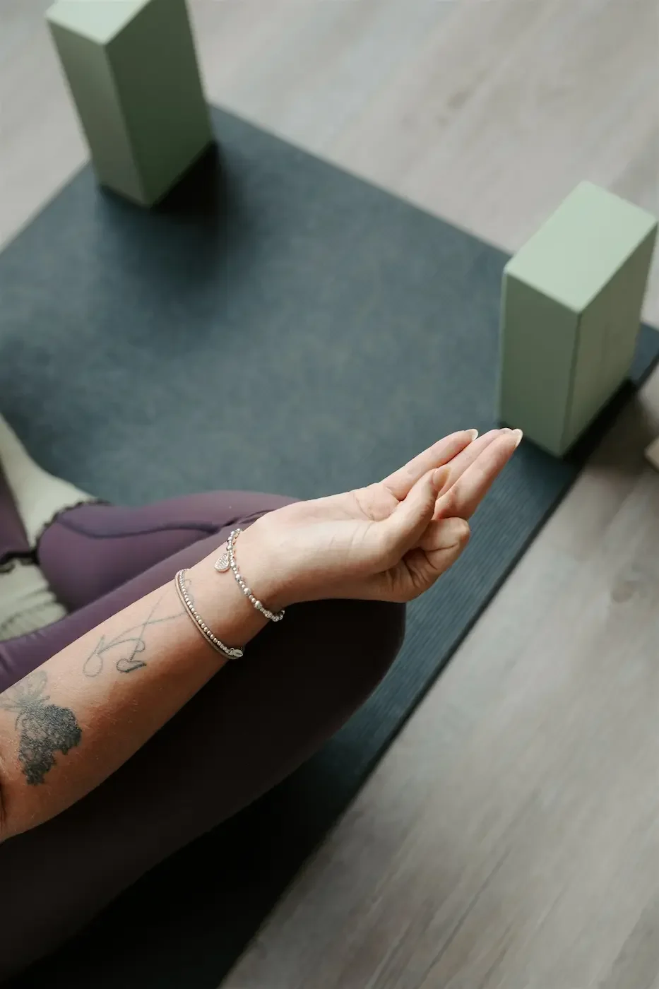 Close-up of a hand in a mudra during a yoga class at Meridian Yoga & Pilates in Glasgow’s East End