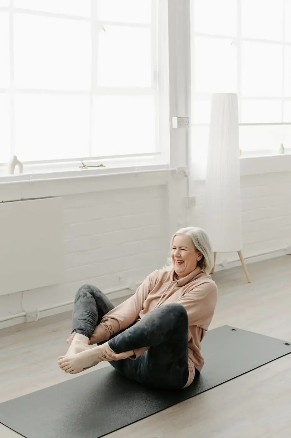 Victoria Cunningham teaching a yoga or Pilates class at Meridian Yoga and Pilates studio in Glasgow, guiding students in a calm and supportive environment.