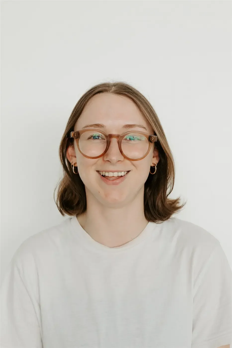 Glasgow yoga teacher trainer Tally Kerr smiling warmly, creating a friendly and approachable atmosphere.