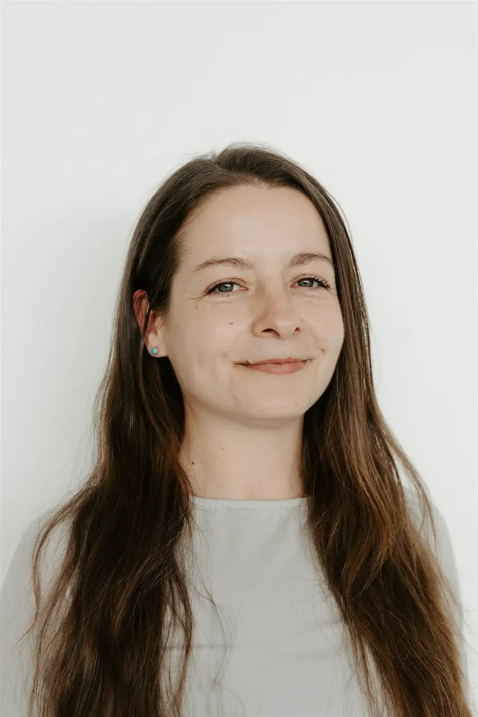 Portrait of Sheree Brown, yoga teacher at Meridian Yoga & Pilates, smiling in the studio