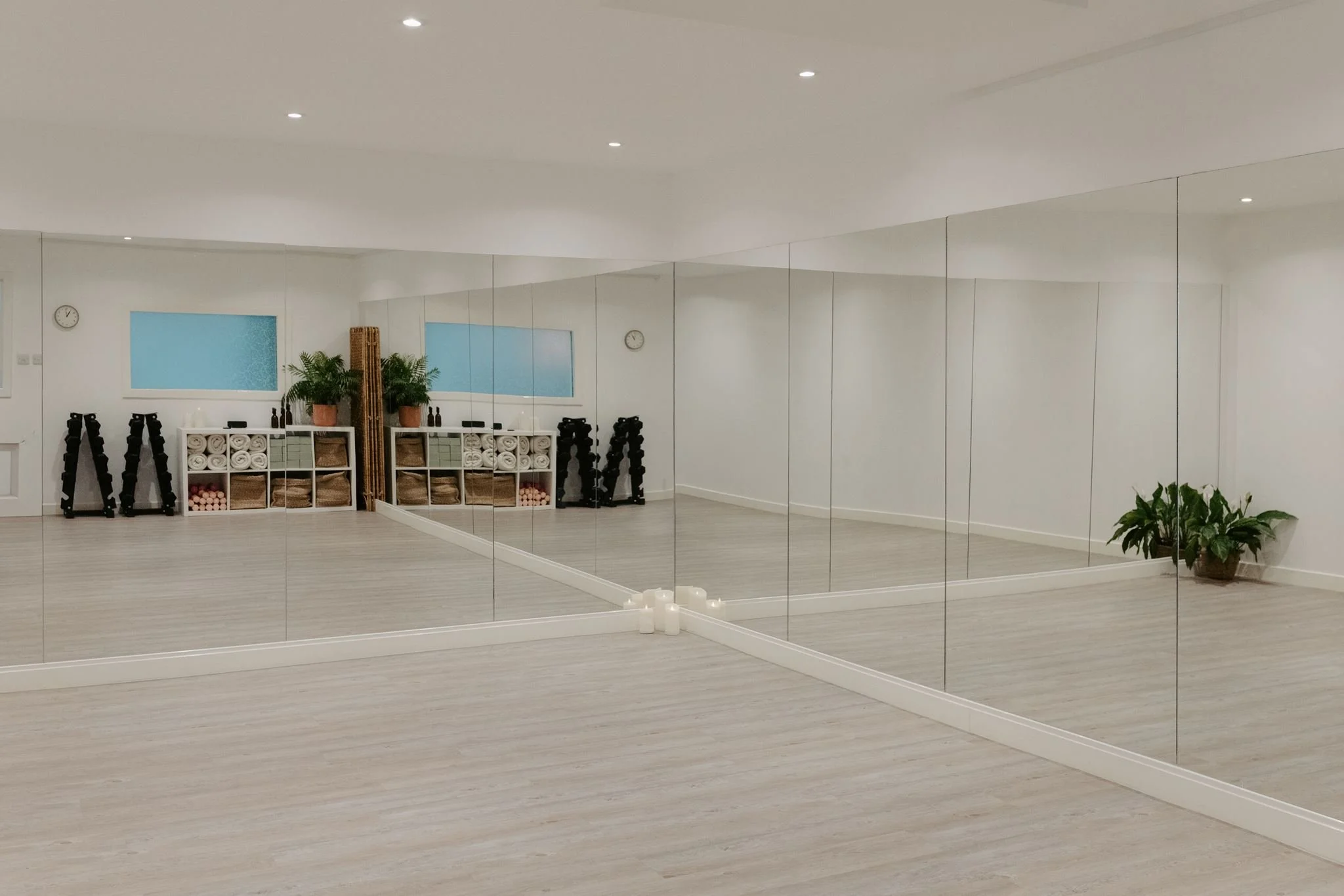 Cosy yoga studio in Glasgow's East End with soft lighting and a calming space for restorative yoga and meditation