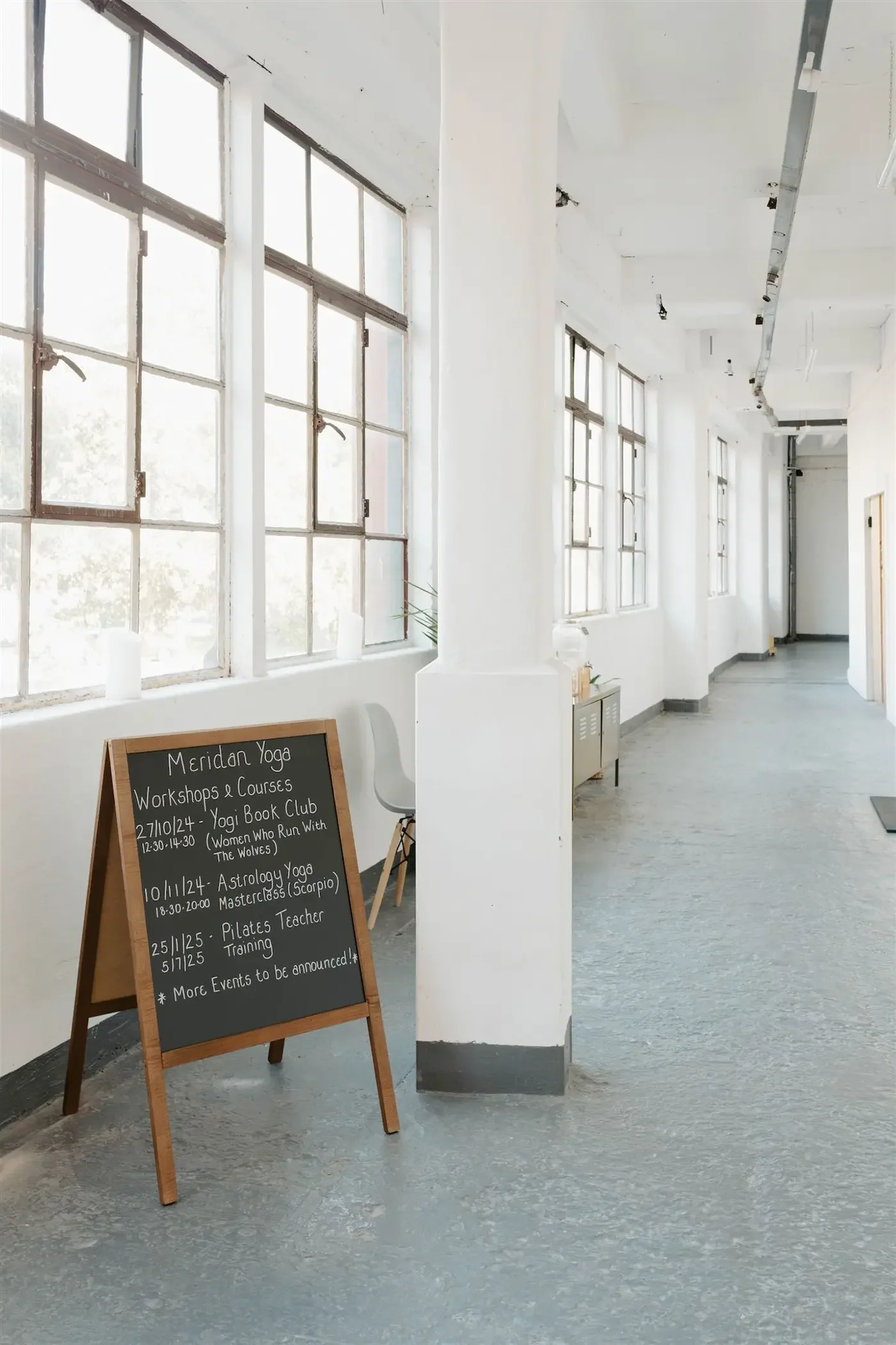 Hallway at the entrance of Meridian Yoga & Pilates in Glasgow’s East End, filled with natural light from large windows