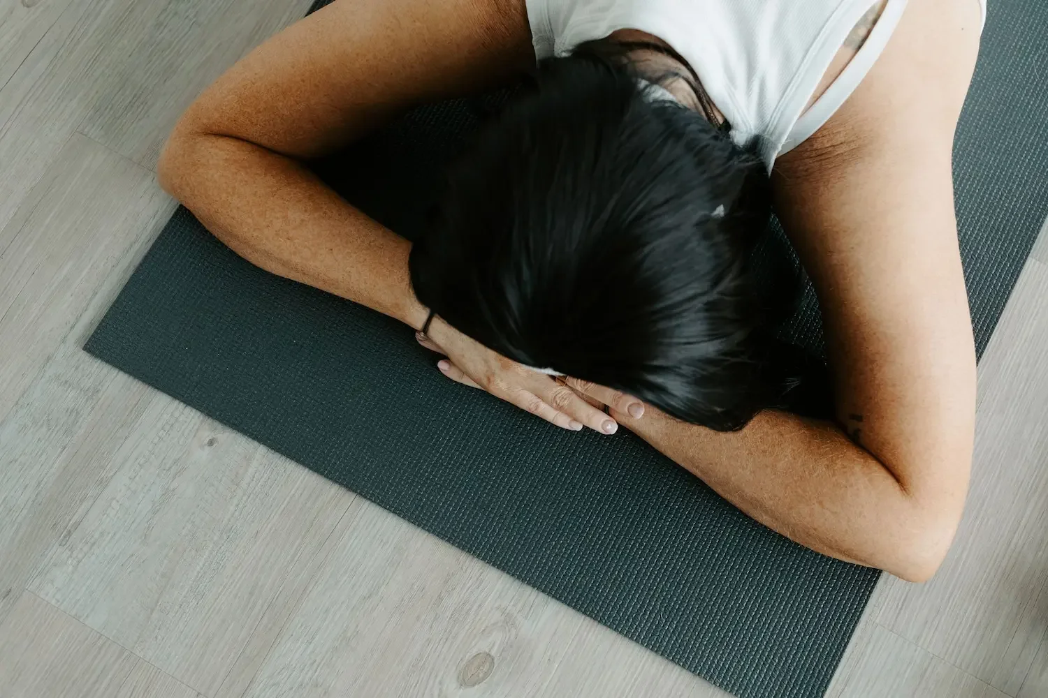 Person practicing a relaxing Yin Yoga posture during an evening Yin class at Meridian Yoga and Pilates in Glasgow