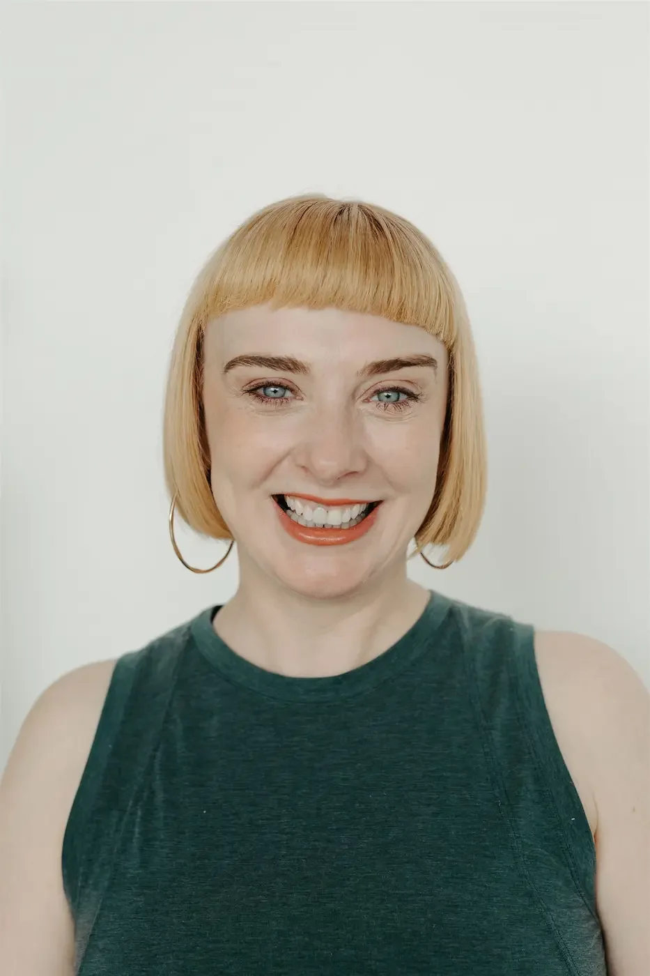 Glasgow yoga teacher trainer Michelle Lang smiling warmly, conveying a friendly and welcoming presence.