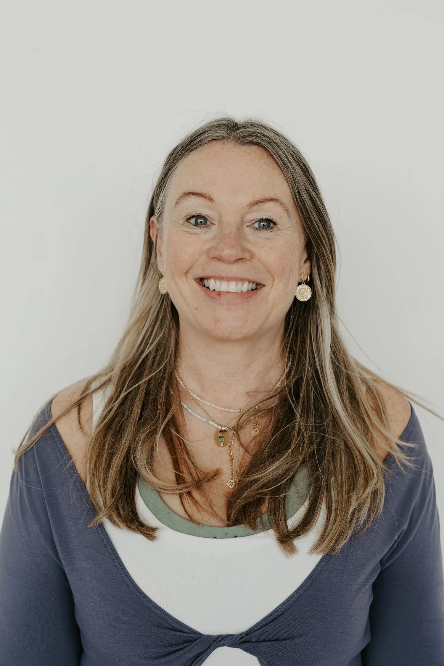 Image of Gillian Campbell, yoga instructor at Meridian Yoga & Pilates, smiling in the studio