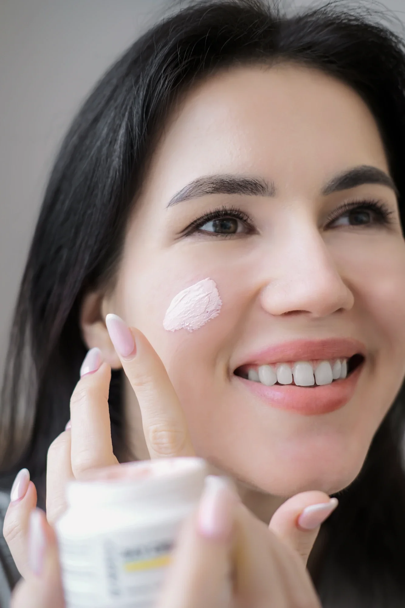 Dr. Besca — applying cream to the skin