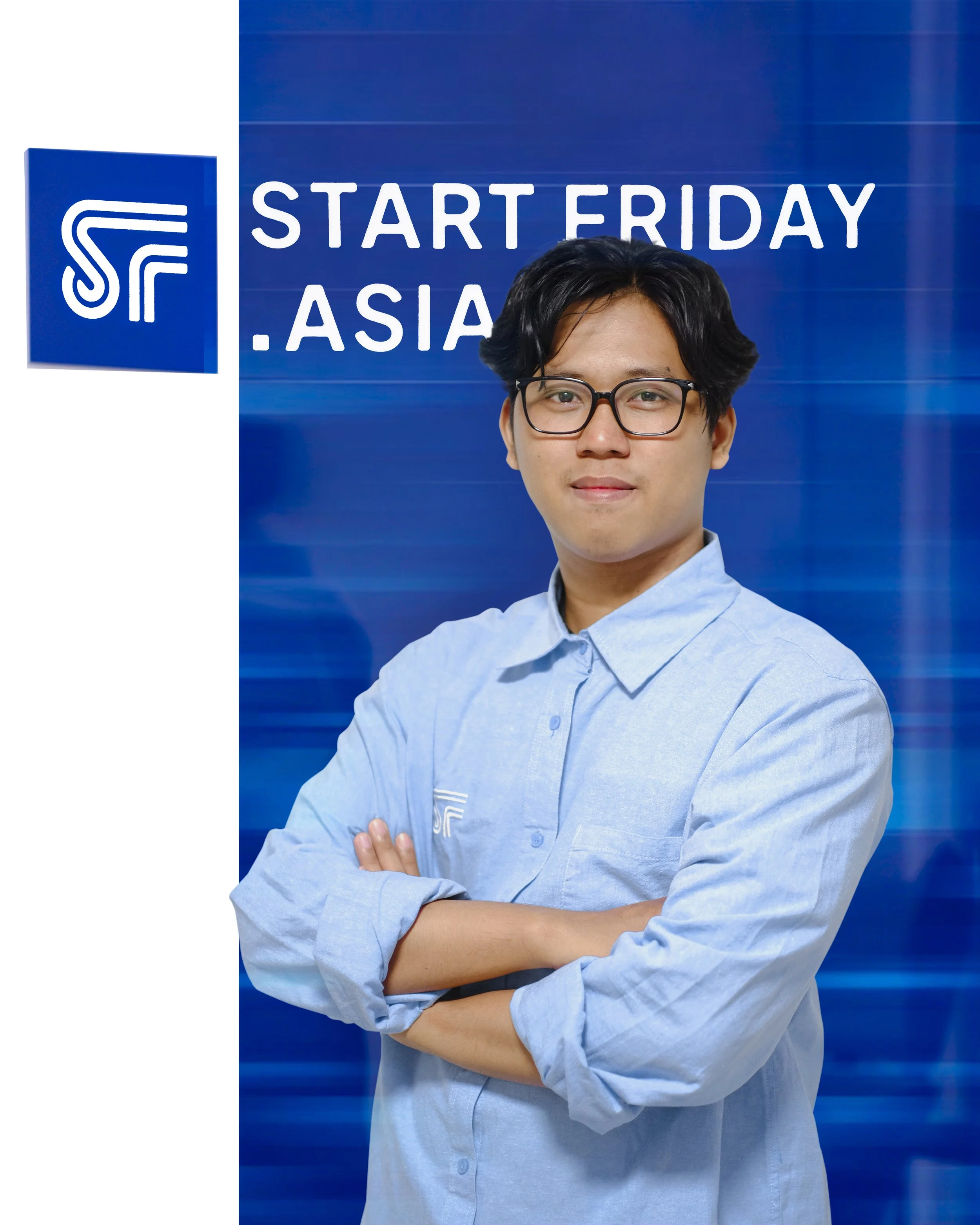 A young man with black hair and glasses wearing a light blue button-up shirt, standing in front of a blue background with the words 'START ERIDAY. ASIA' and a logo.