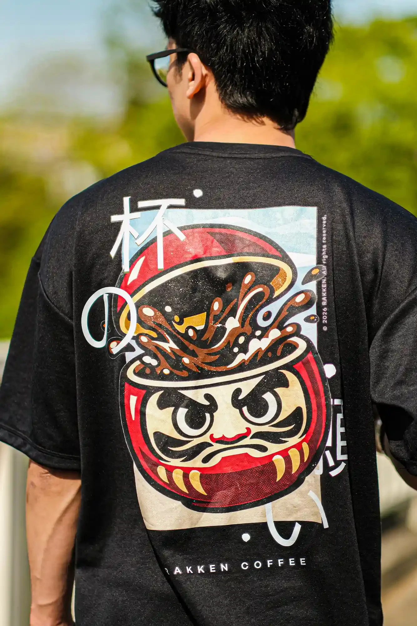 Rakken Coffee Merch -- Black Tee - look