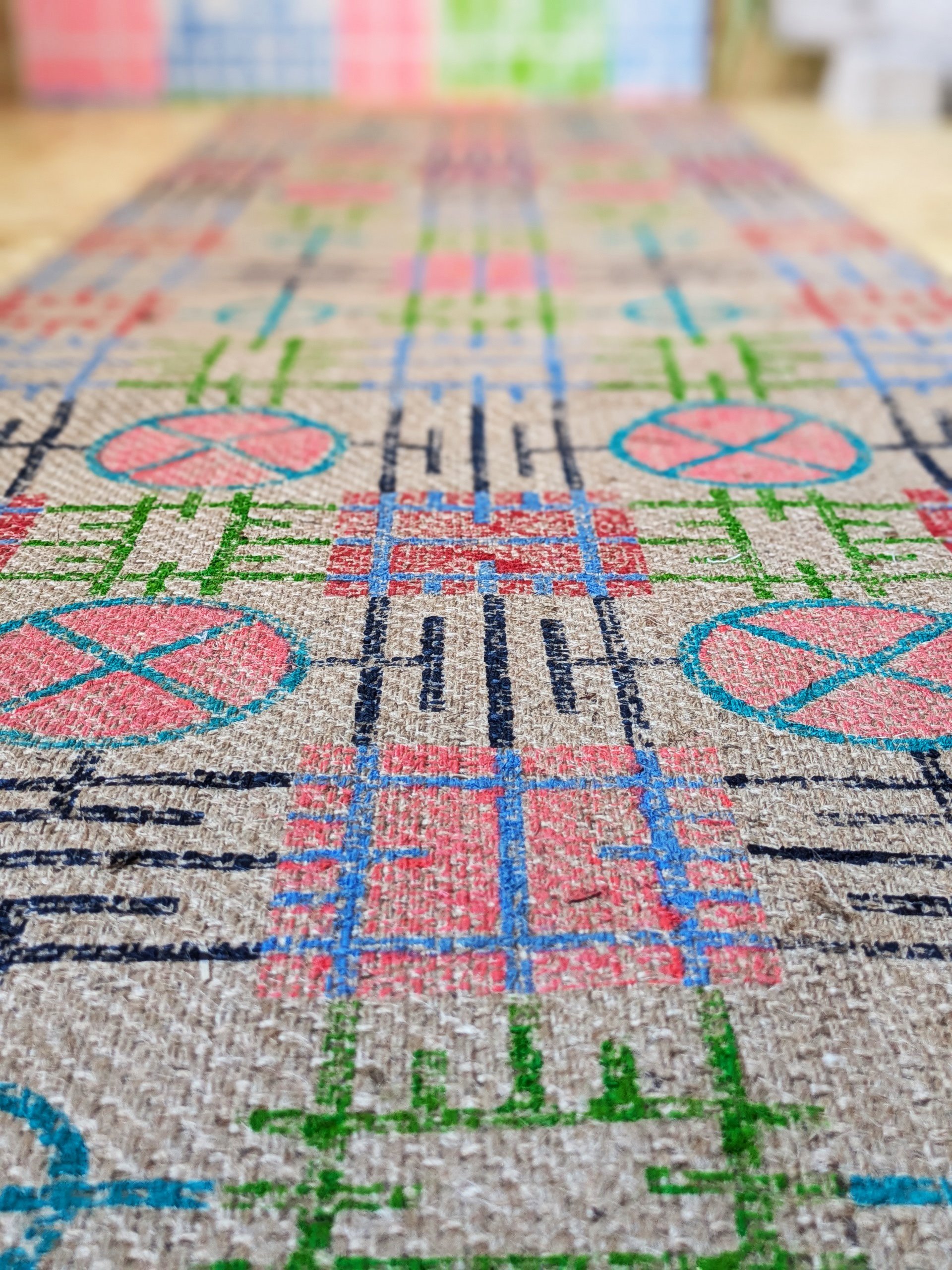 close-up detail of block printed jute runner in vivid graphic architectural print