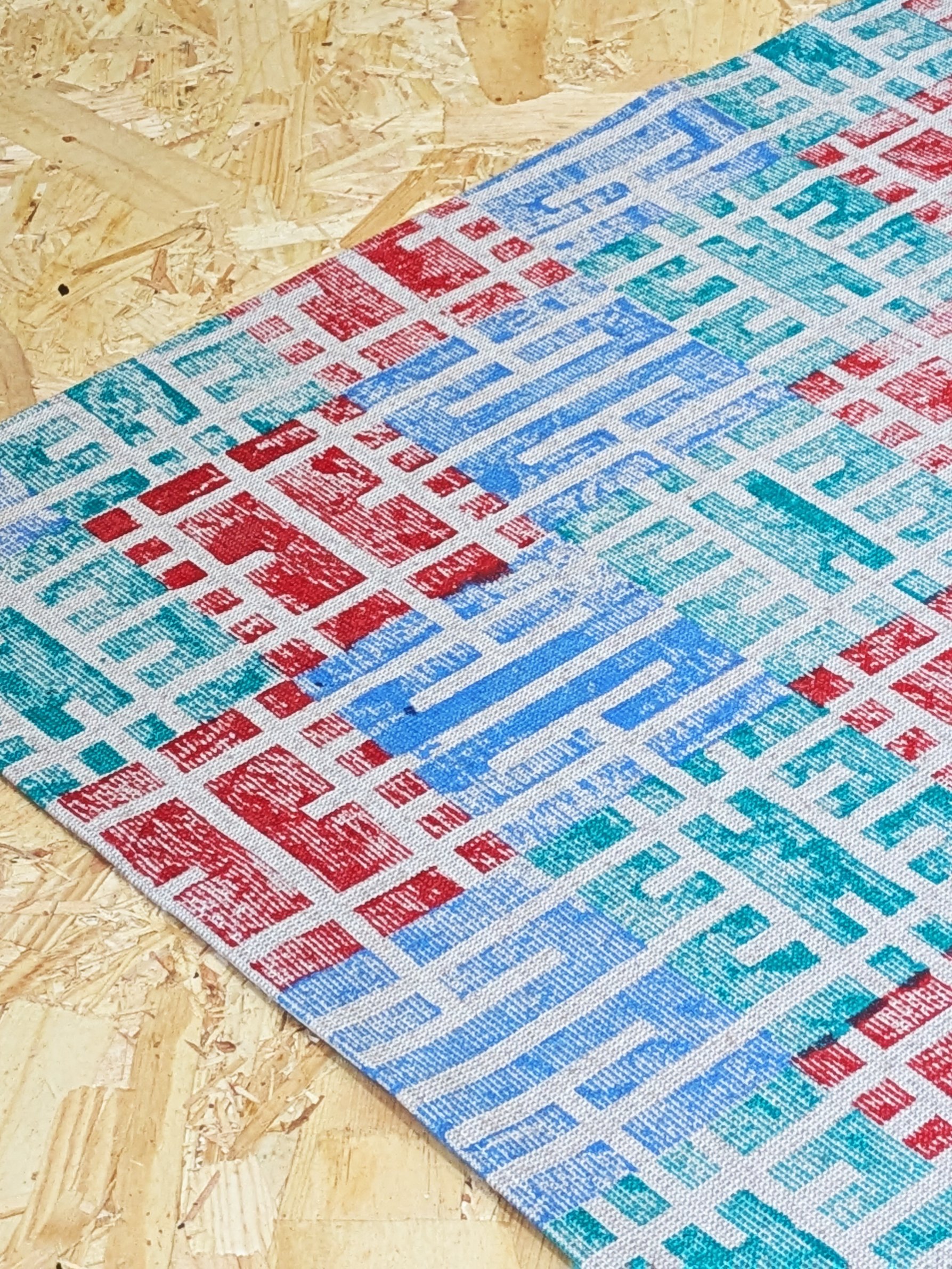 block printed grid like pattern on teatowels in contemporary colourway