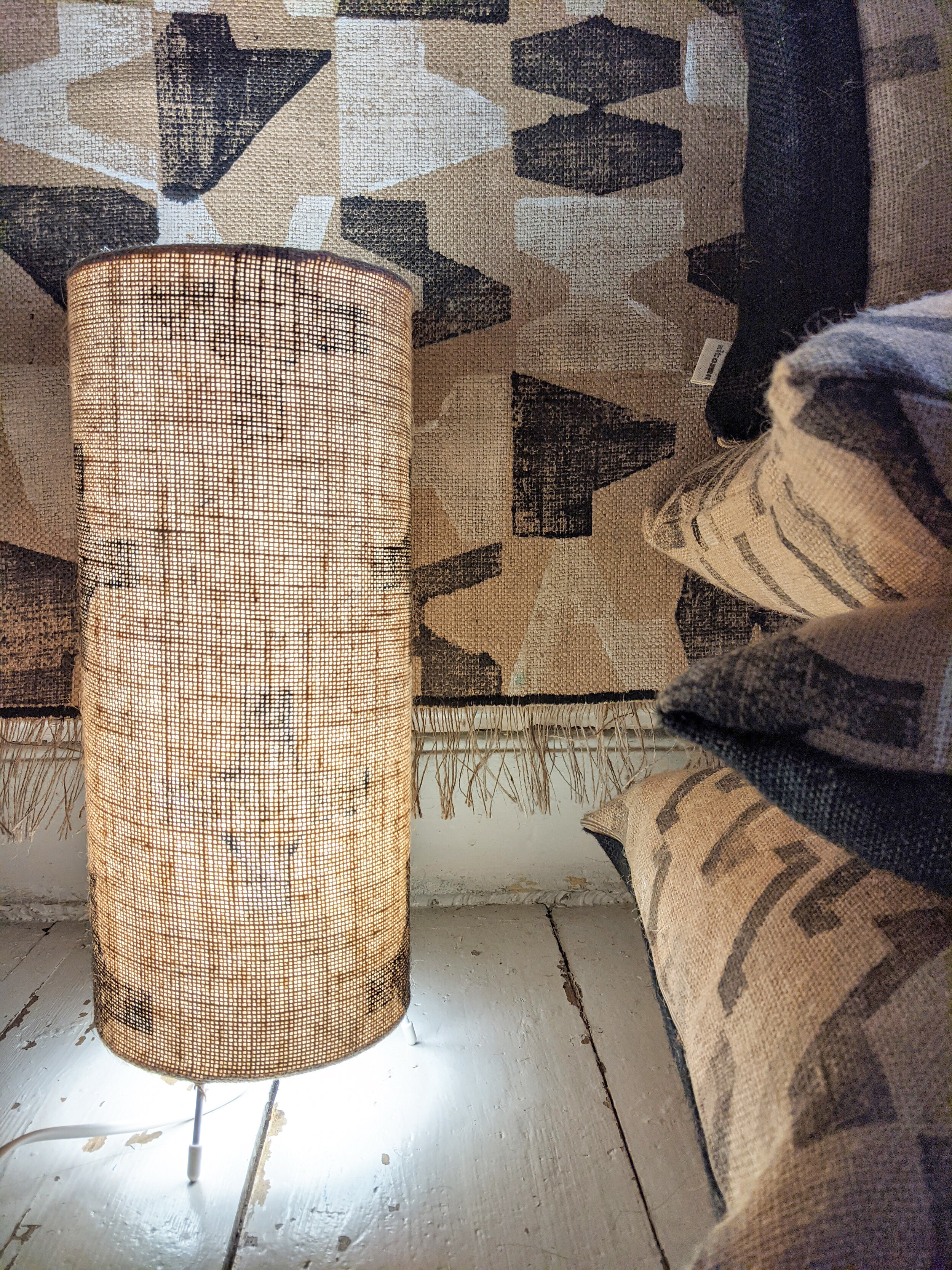 CO-OP small floor lamp with black and white geometric print design in interior scene with cushions