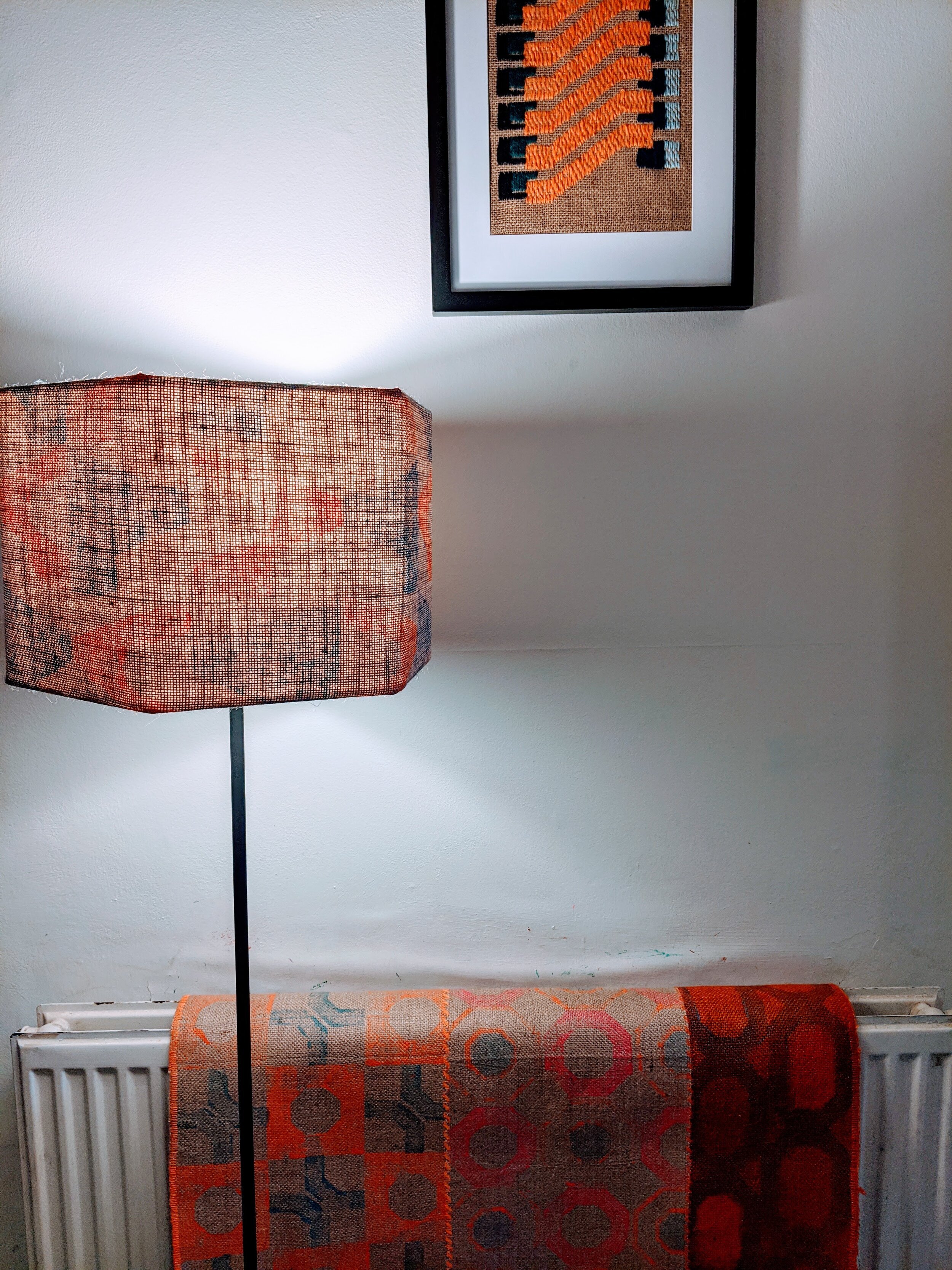 MÁVAUT hexagonal lampshade with orange and blue print and shadows