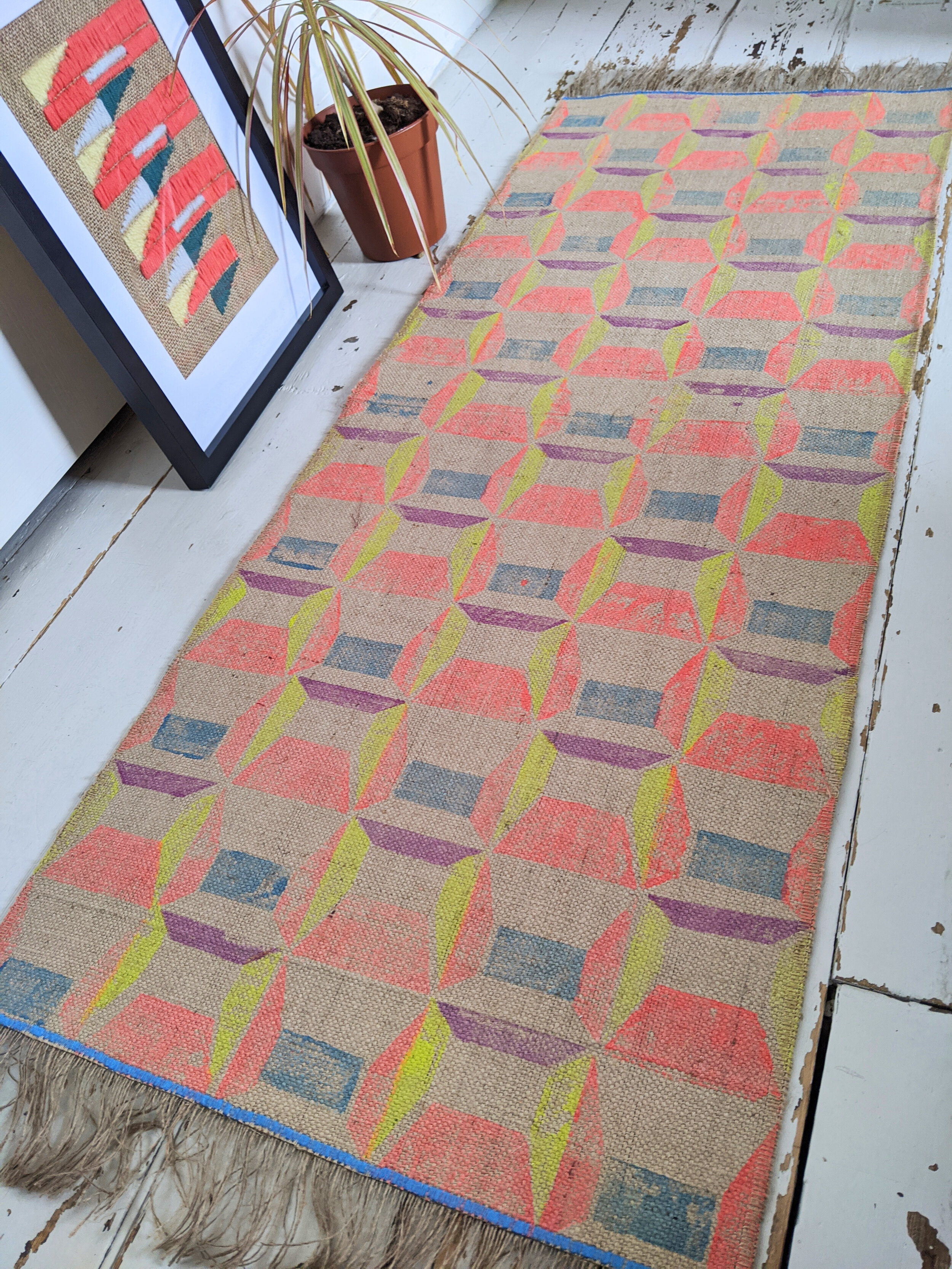 ABLAK block printed rug with geometric pattern in bright red, blue and yellow