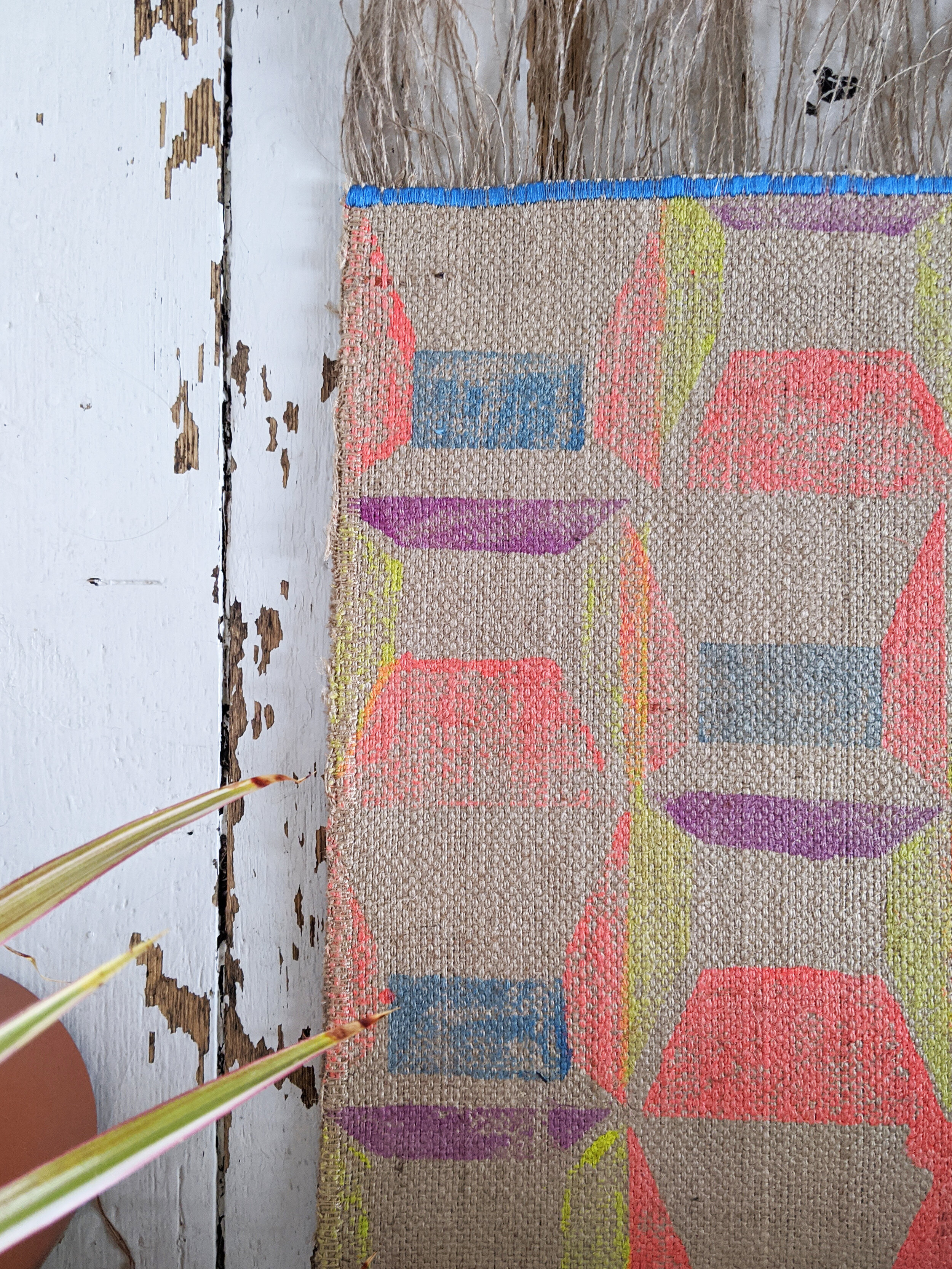 ABLAK block printed rug with brutalist geometric pattern in bright red and yellow