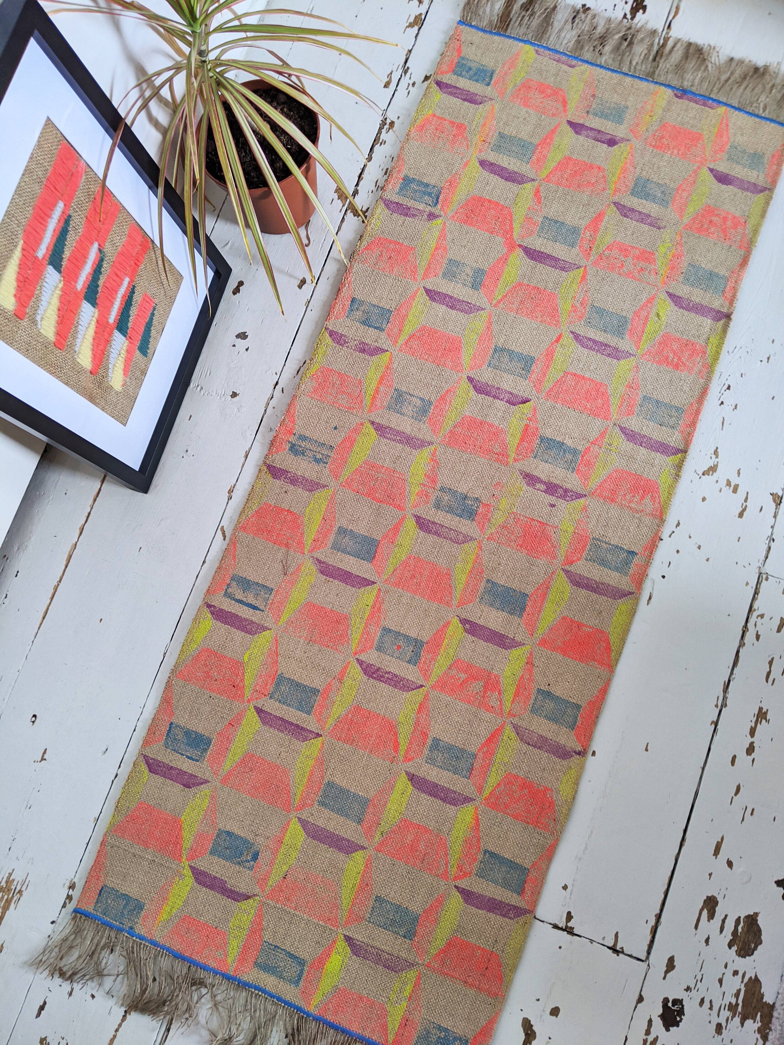 ABLAK block printed rug with geometric pattern in bright red and yellow
