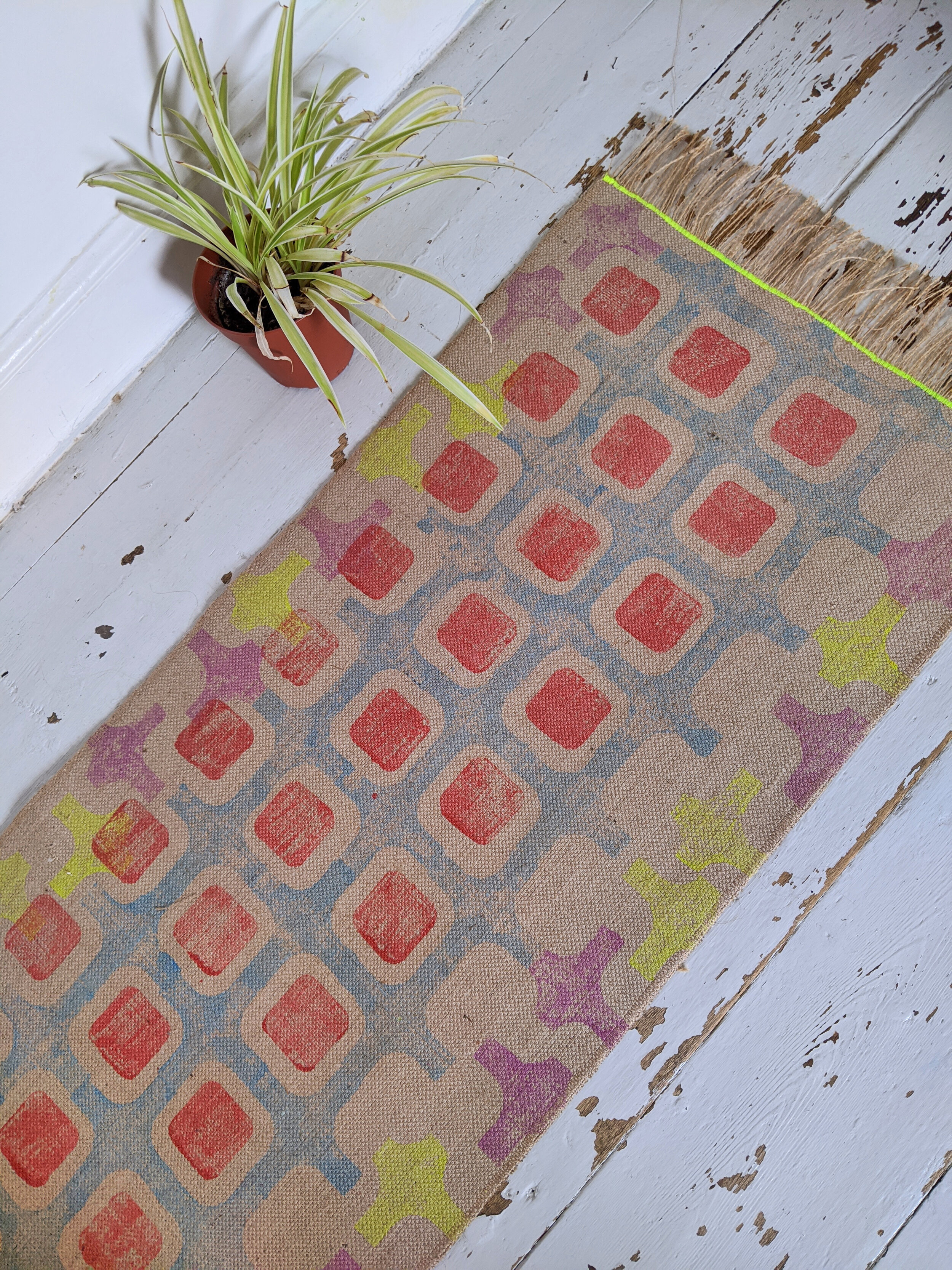 CO-OP runner rug with geometric blue and orange print