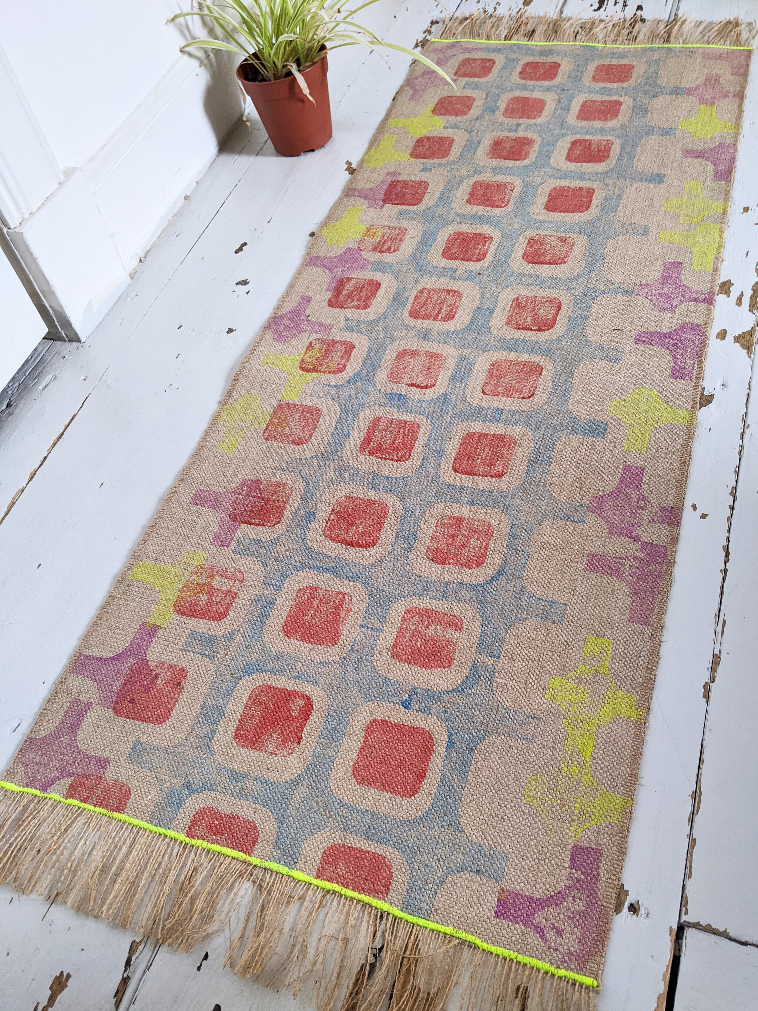 CO-OP runner rug with geometric blue and orange pattern