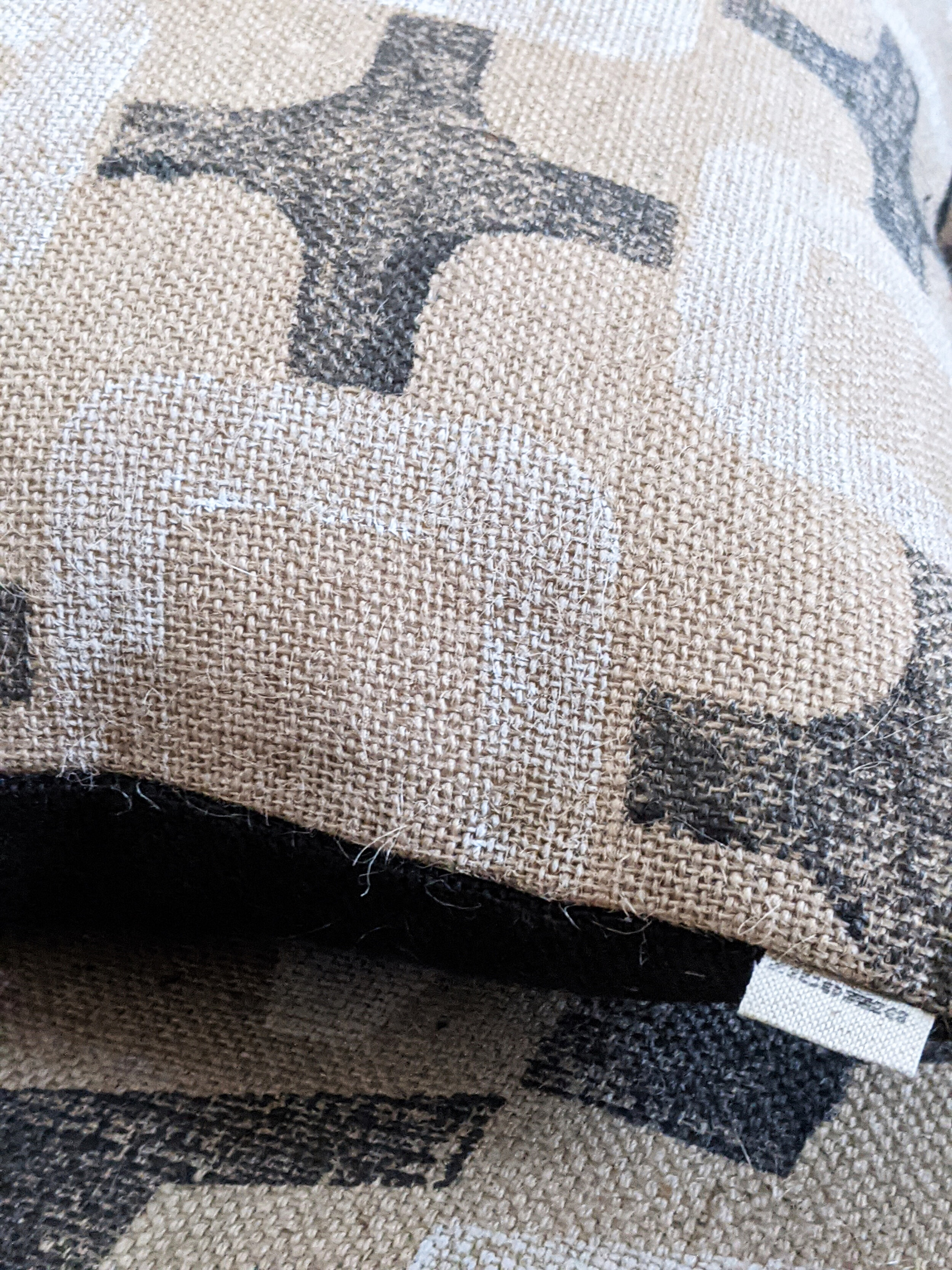 CO-OP black and white brutalist inspired block print on natural jute cushion