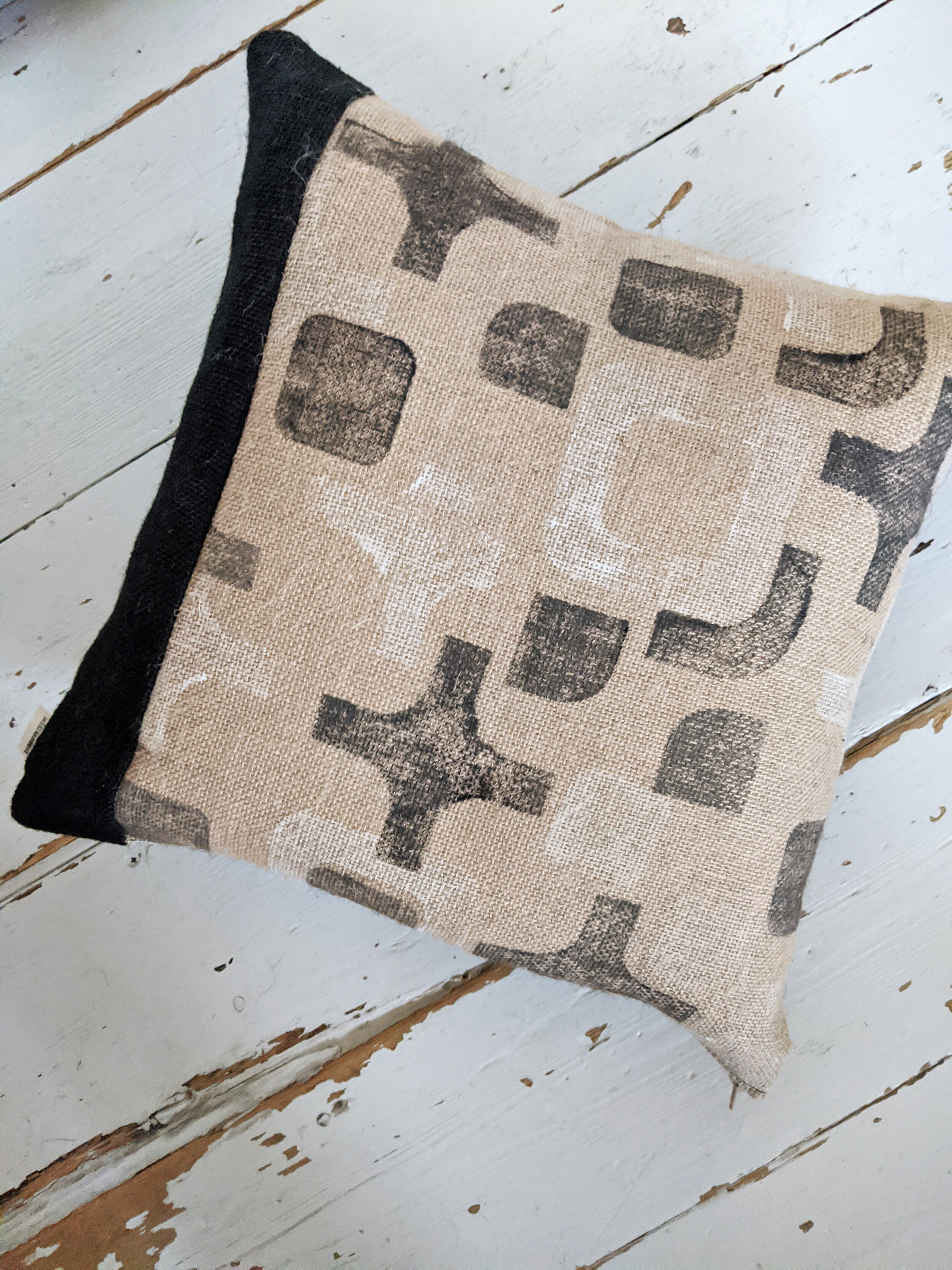 CO-OP black and white geometric random block print on natural jute cushion