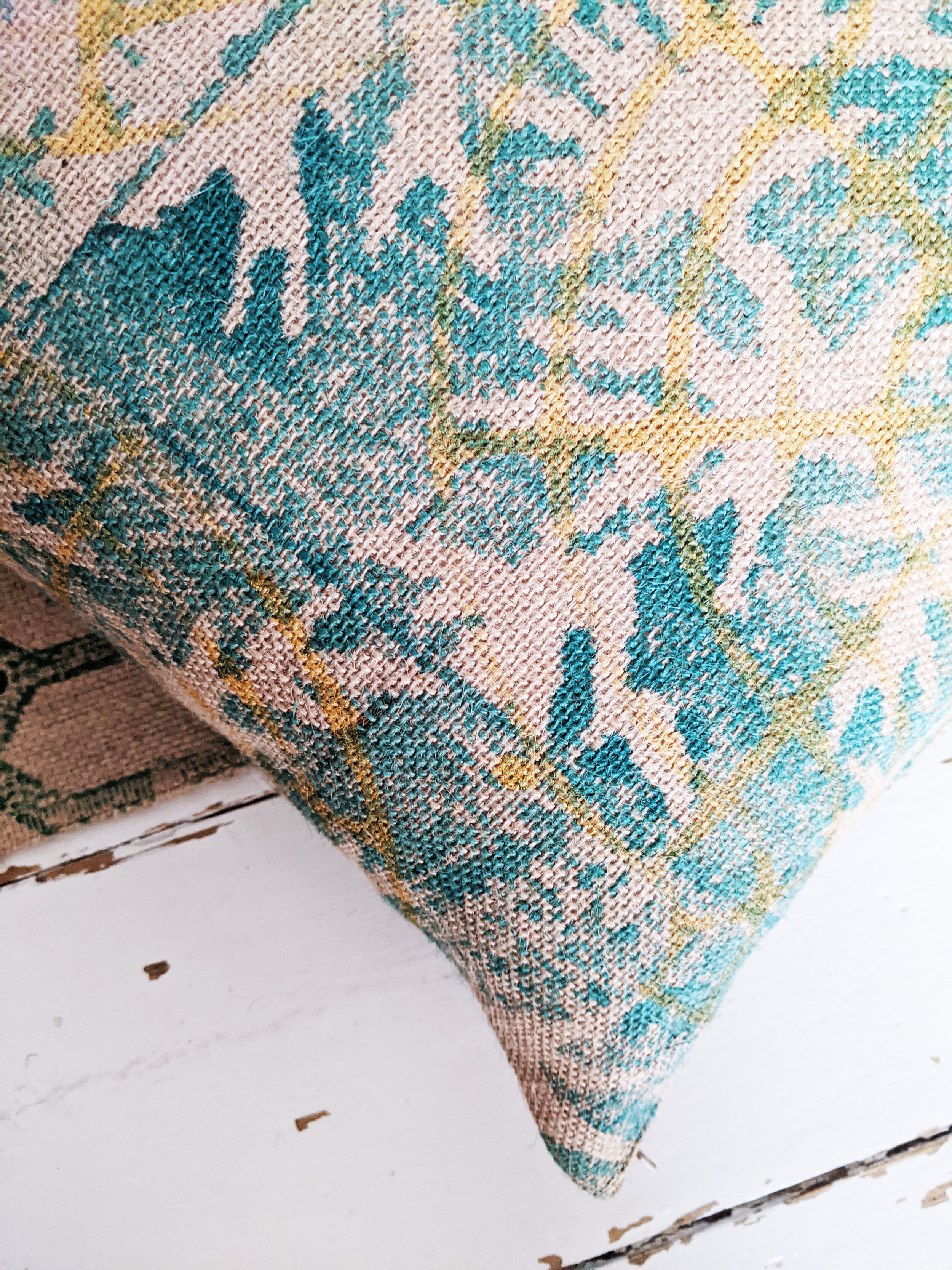 PÁLMAHÁZ block printed jute cushion with a rustic boho tropical block printed pattern