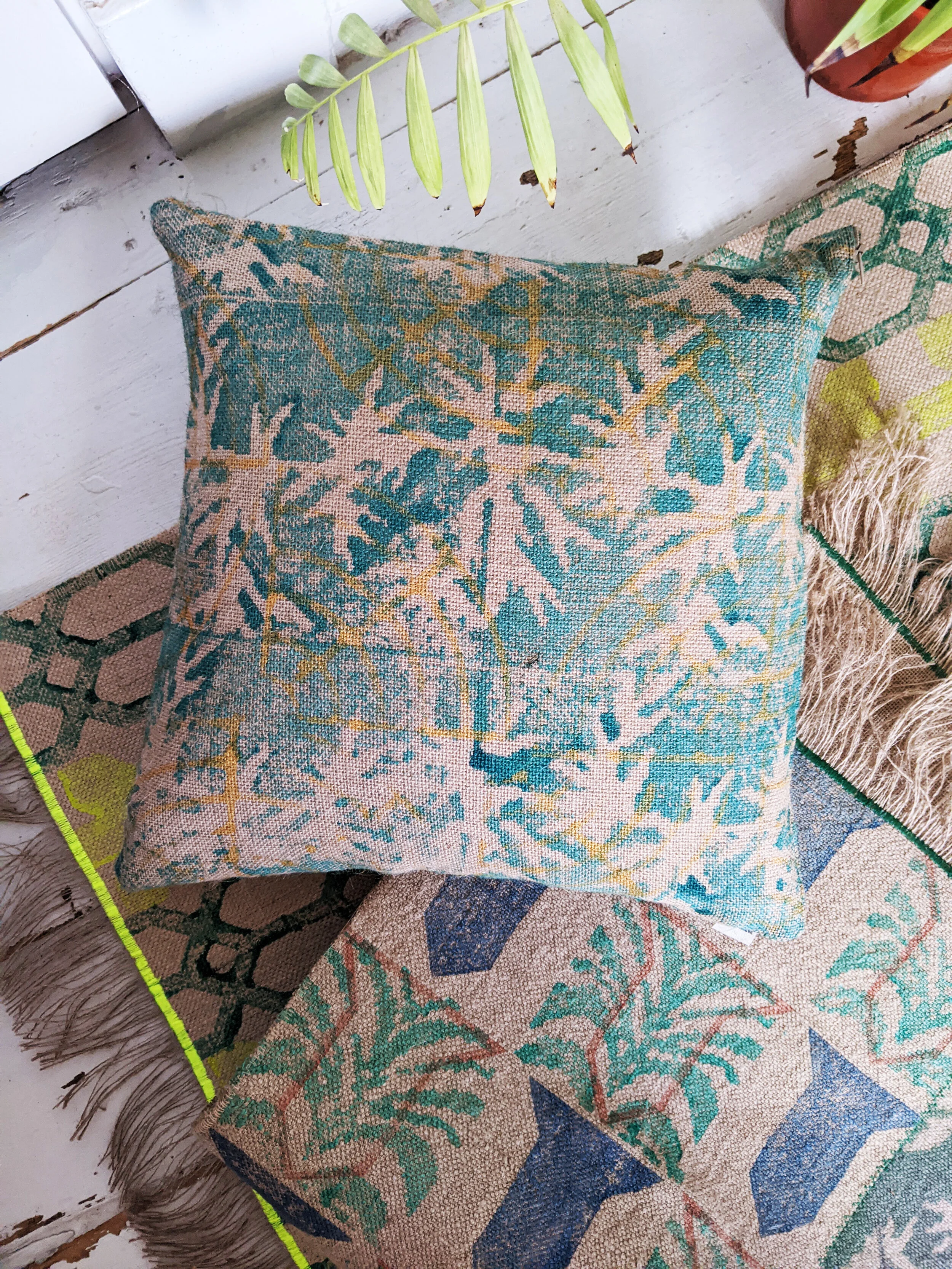 PÁLMAHÁZ block printed jute cushion with a rustic boho tropical block printed pattern
