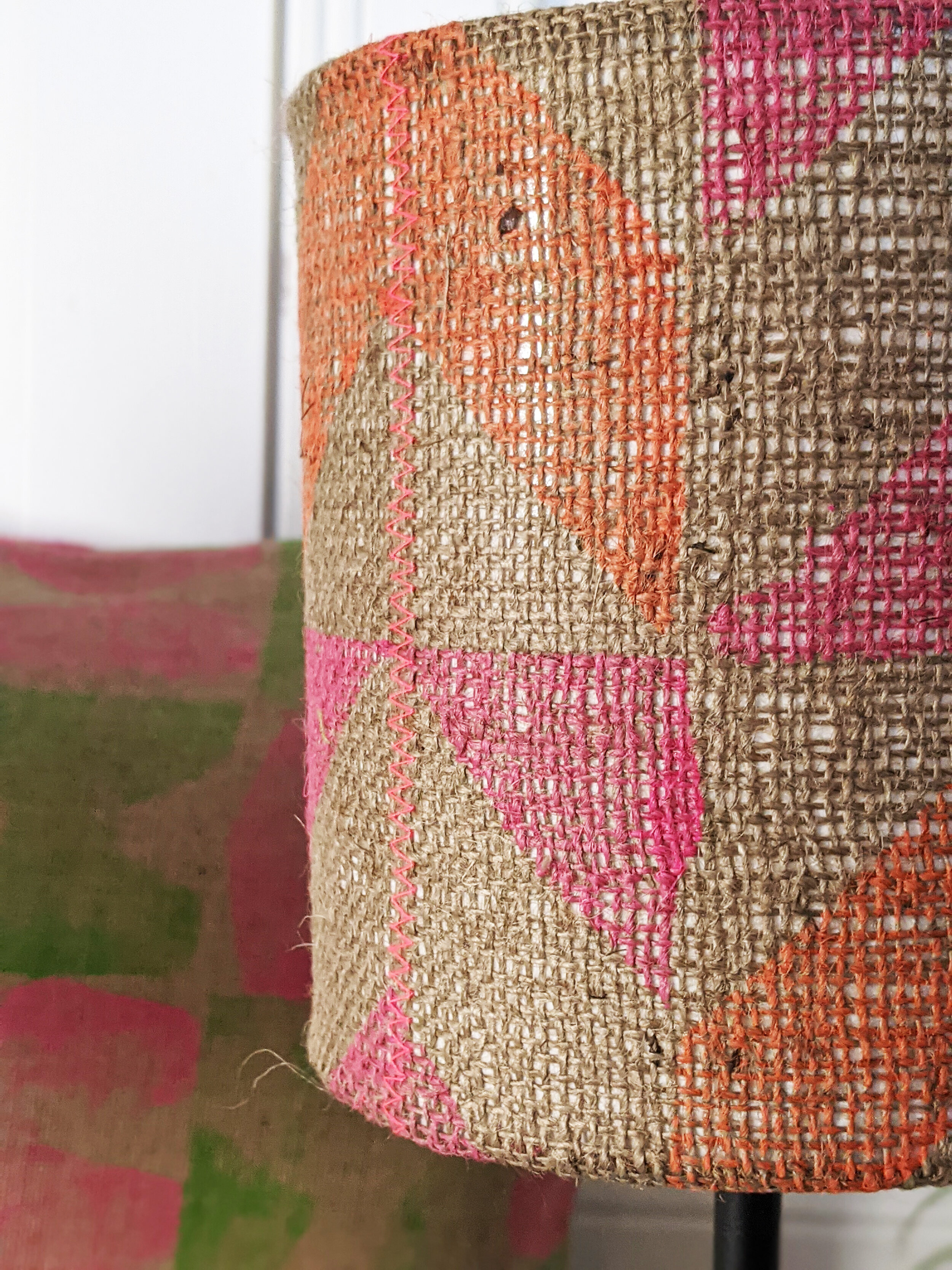 SOROMPÓ hessian lampshade with neon pink and orange pattern zigzag stitch close-up detail of geometric block printed chevron design