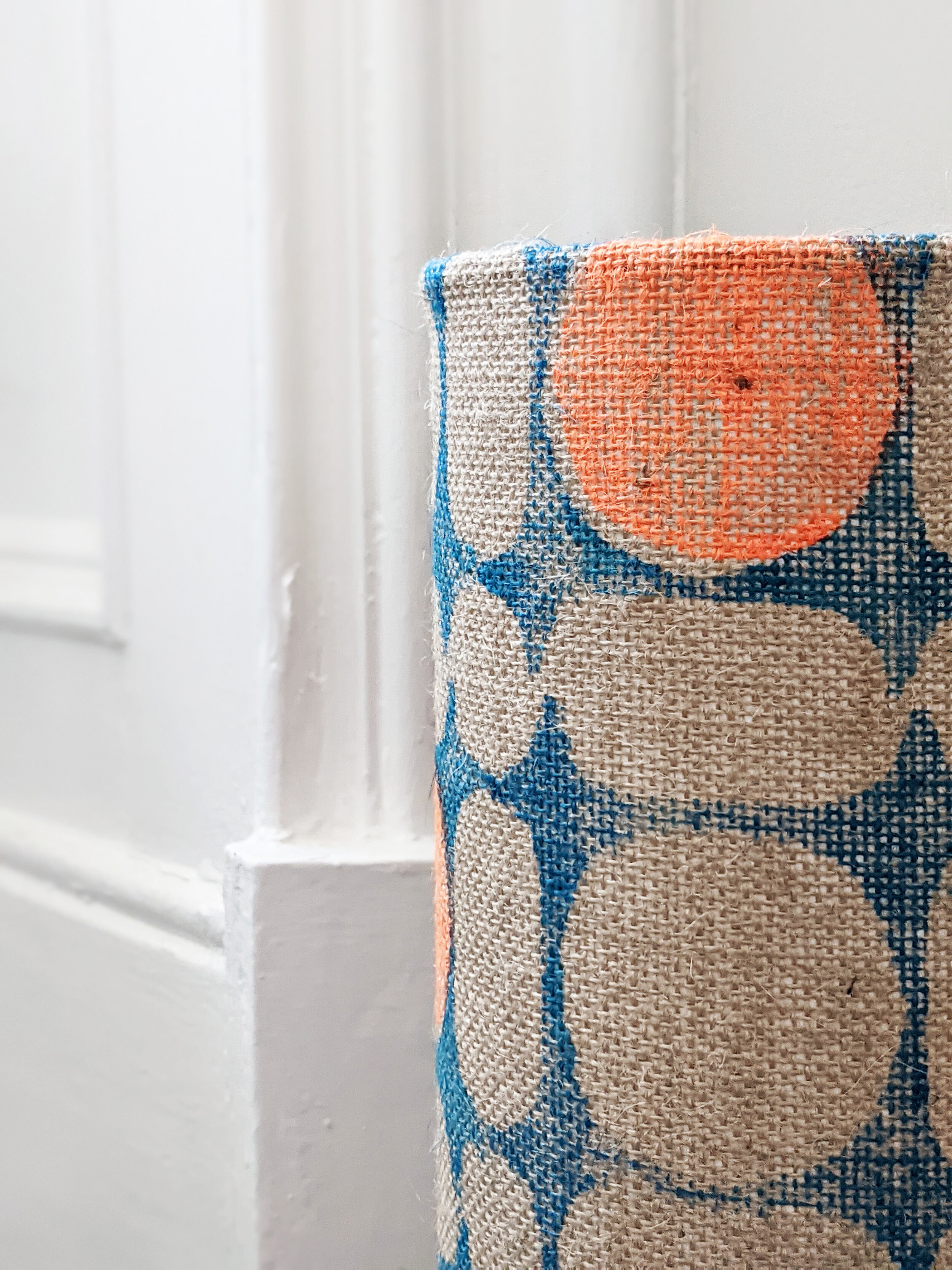 close-up detail of hand printed modernist pattern on natural jute on small floor lamp