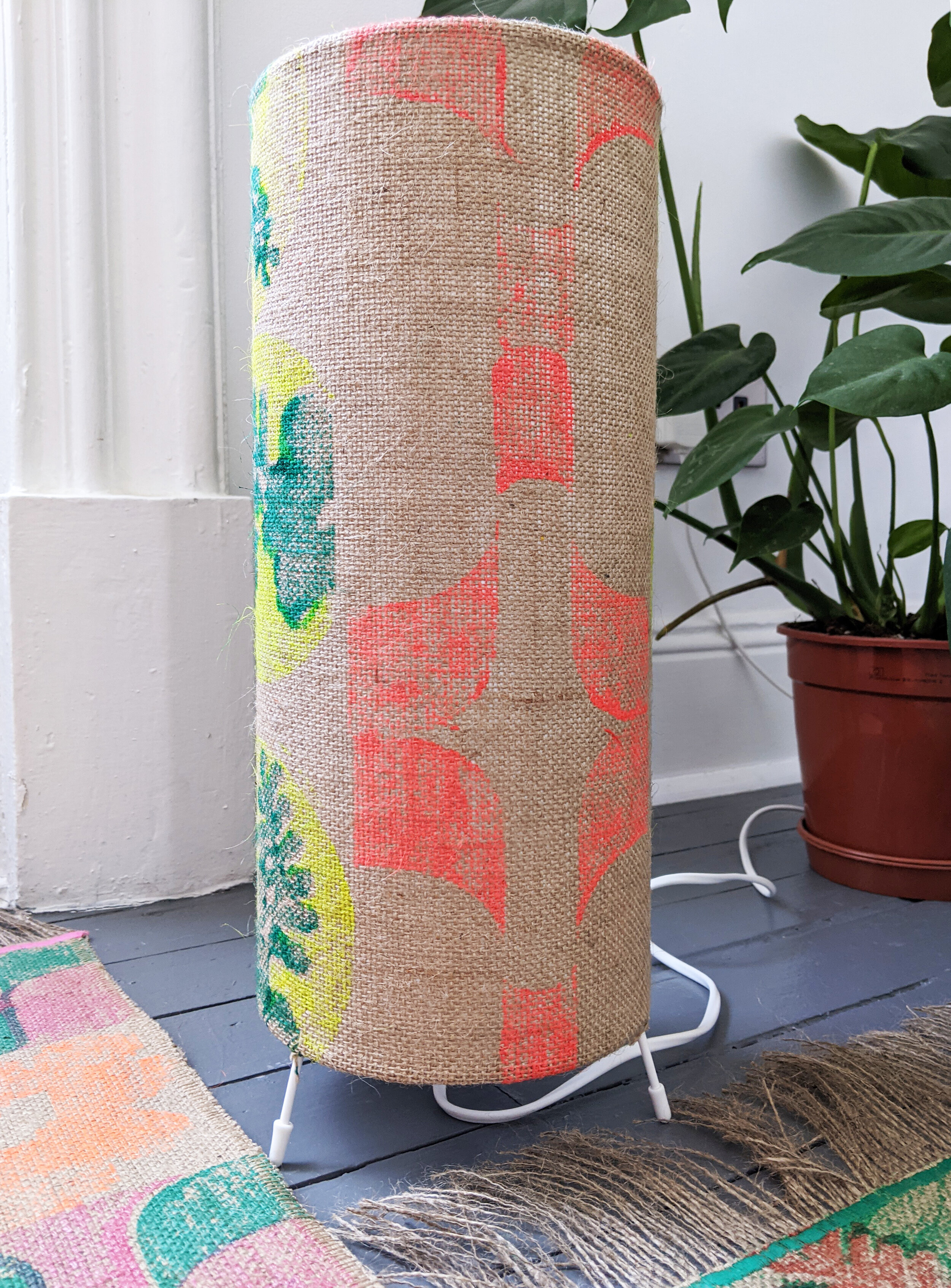 bright red block print with 1970s tropical retro inspired rug and leaves