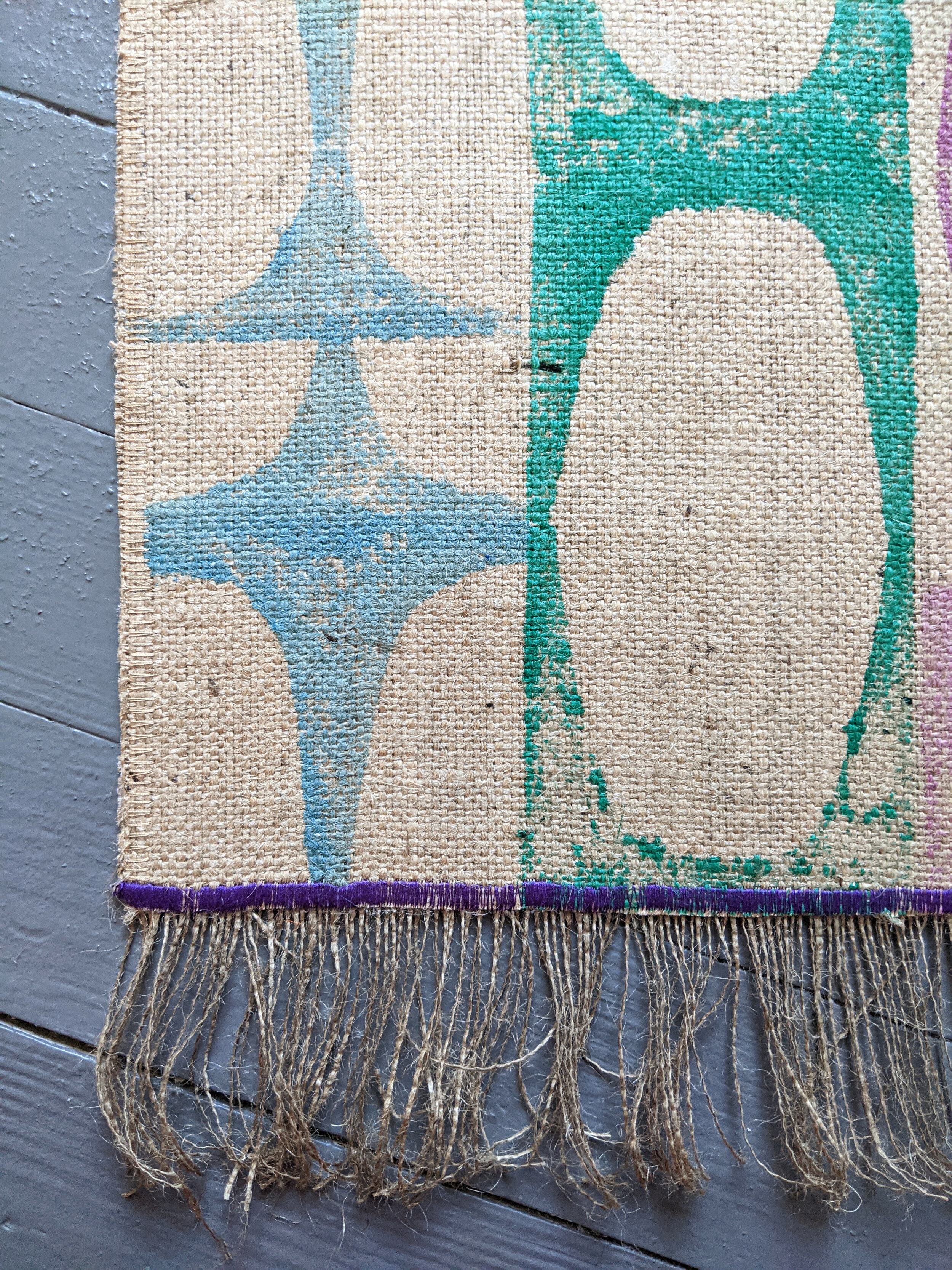 close-up detail of 1960s retro inspired modernist print on jute runner rug