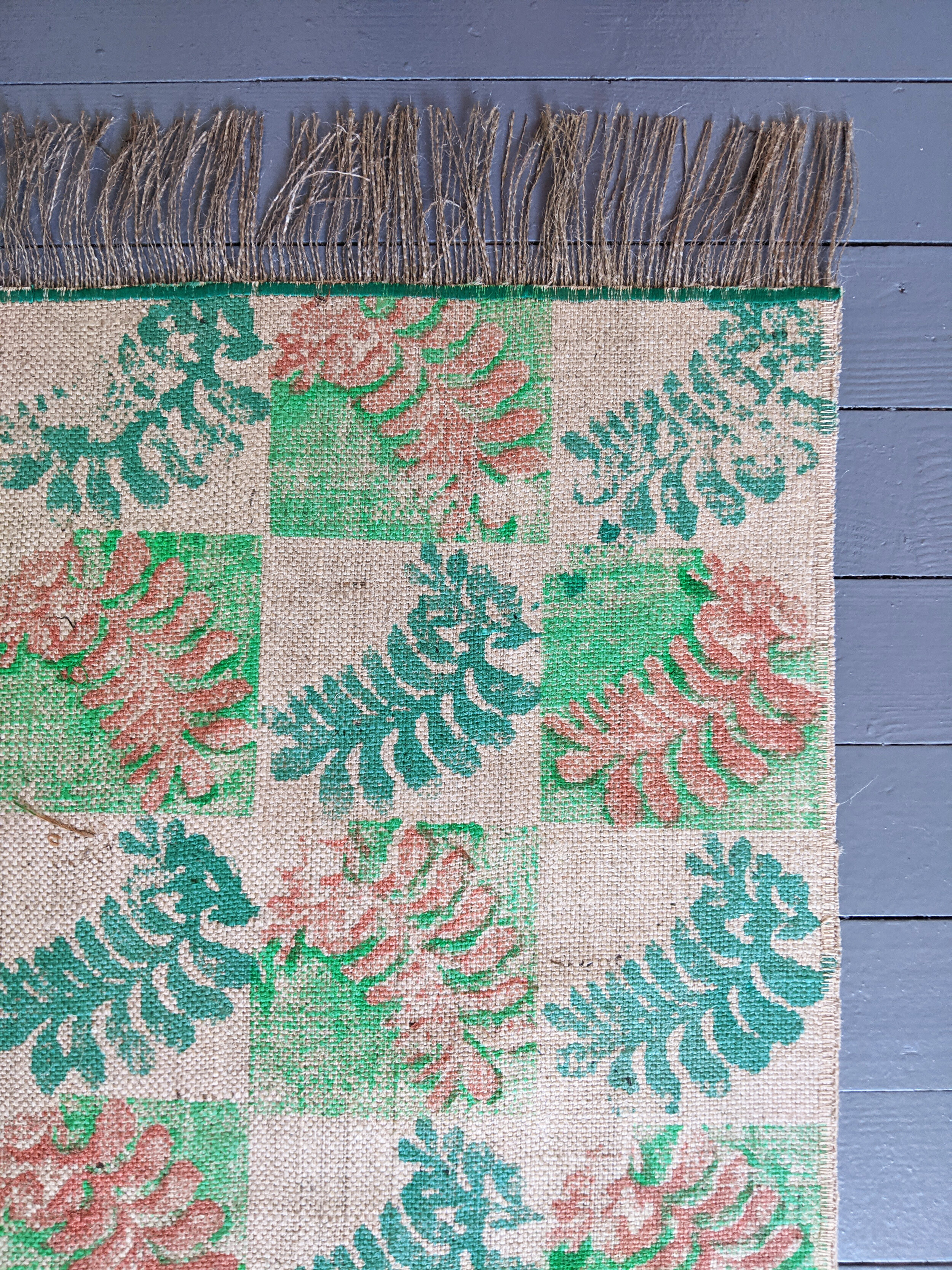 handmade block printed jute rug with green botanical pattern design