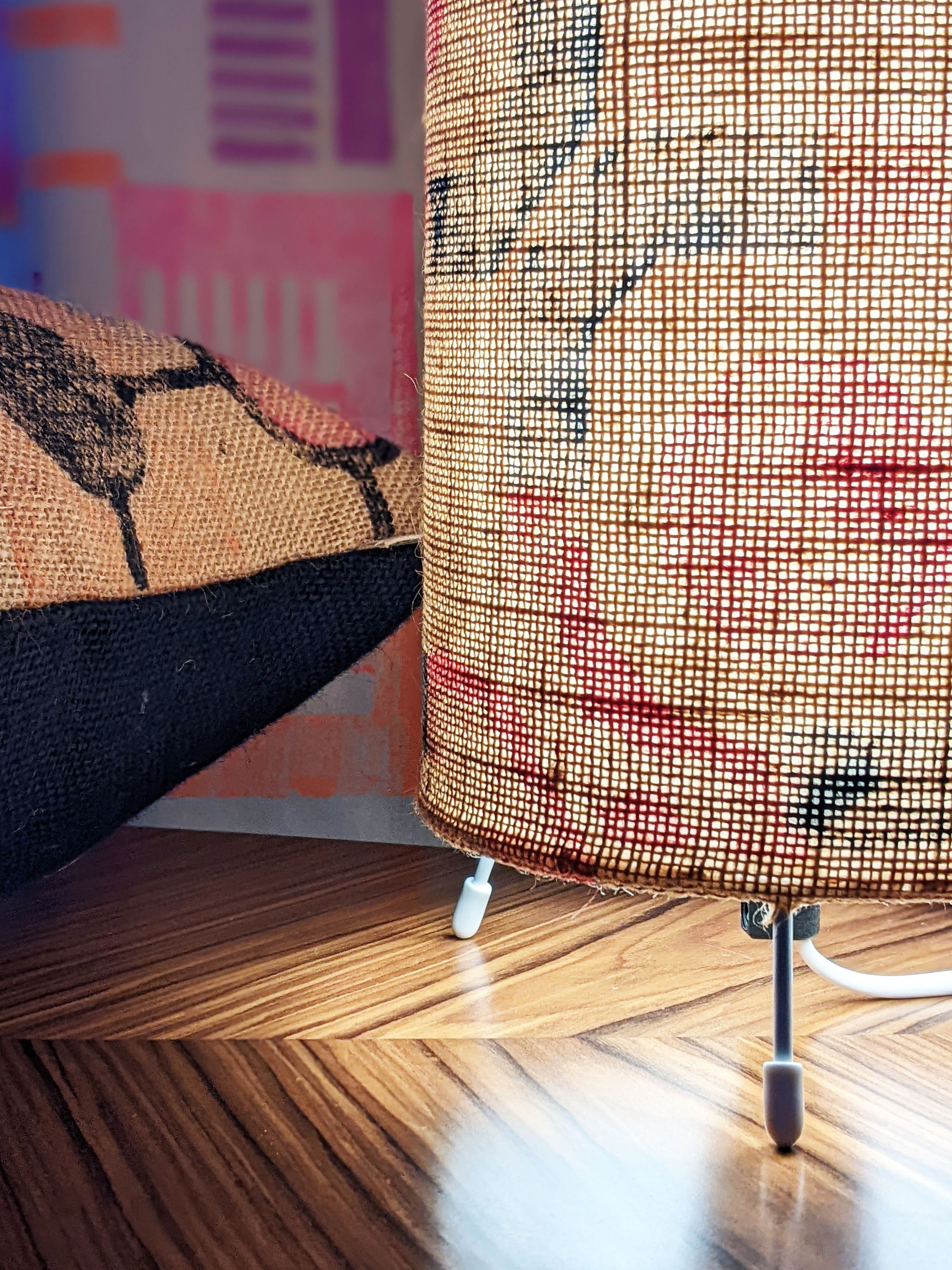 close-up detail of jute texture of lamp on table, illuminated with soft light