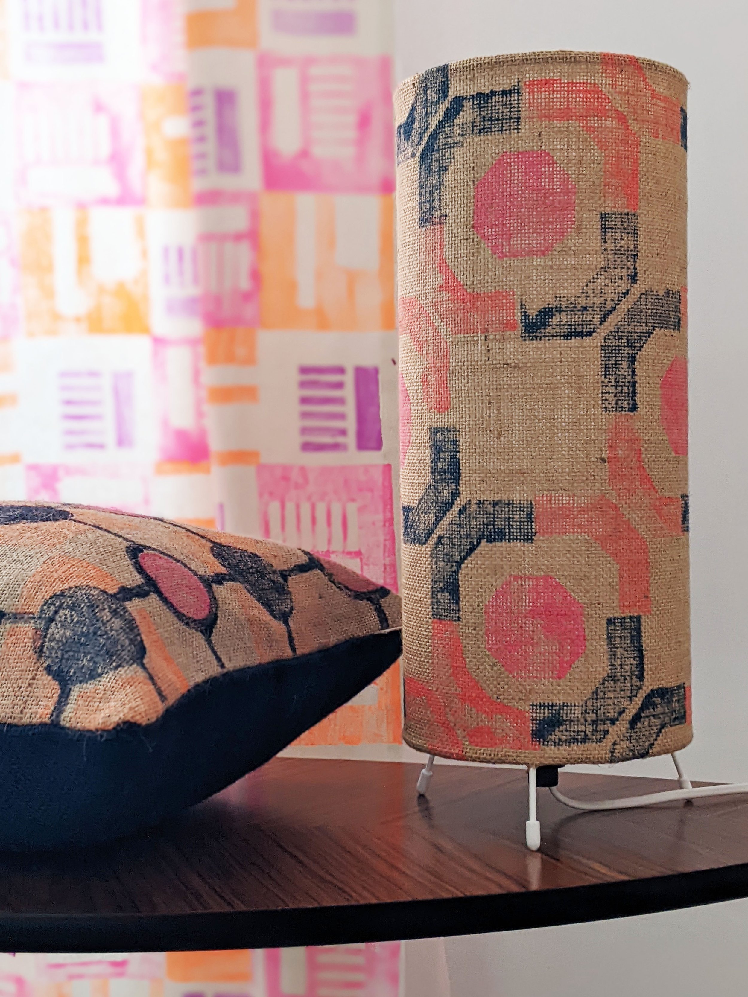 neon pink small lamp on table with block printed geometric pattern design