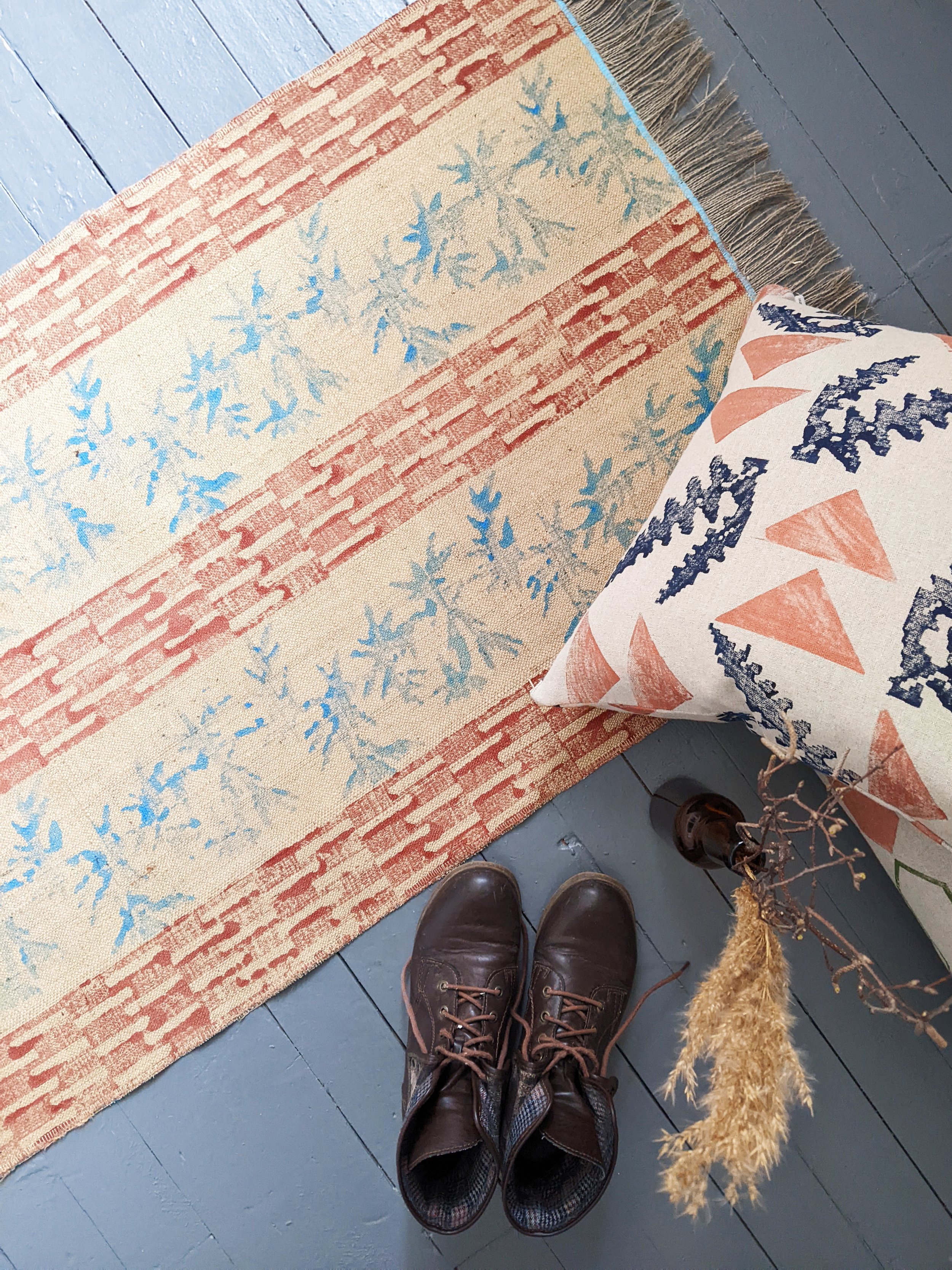 interior scene with travel inspired boho rug on floor