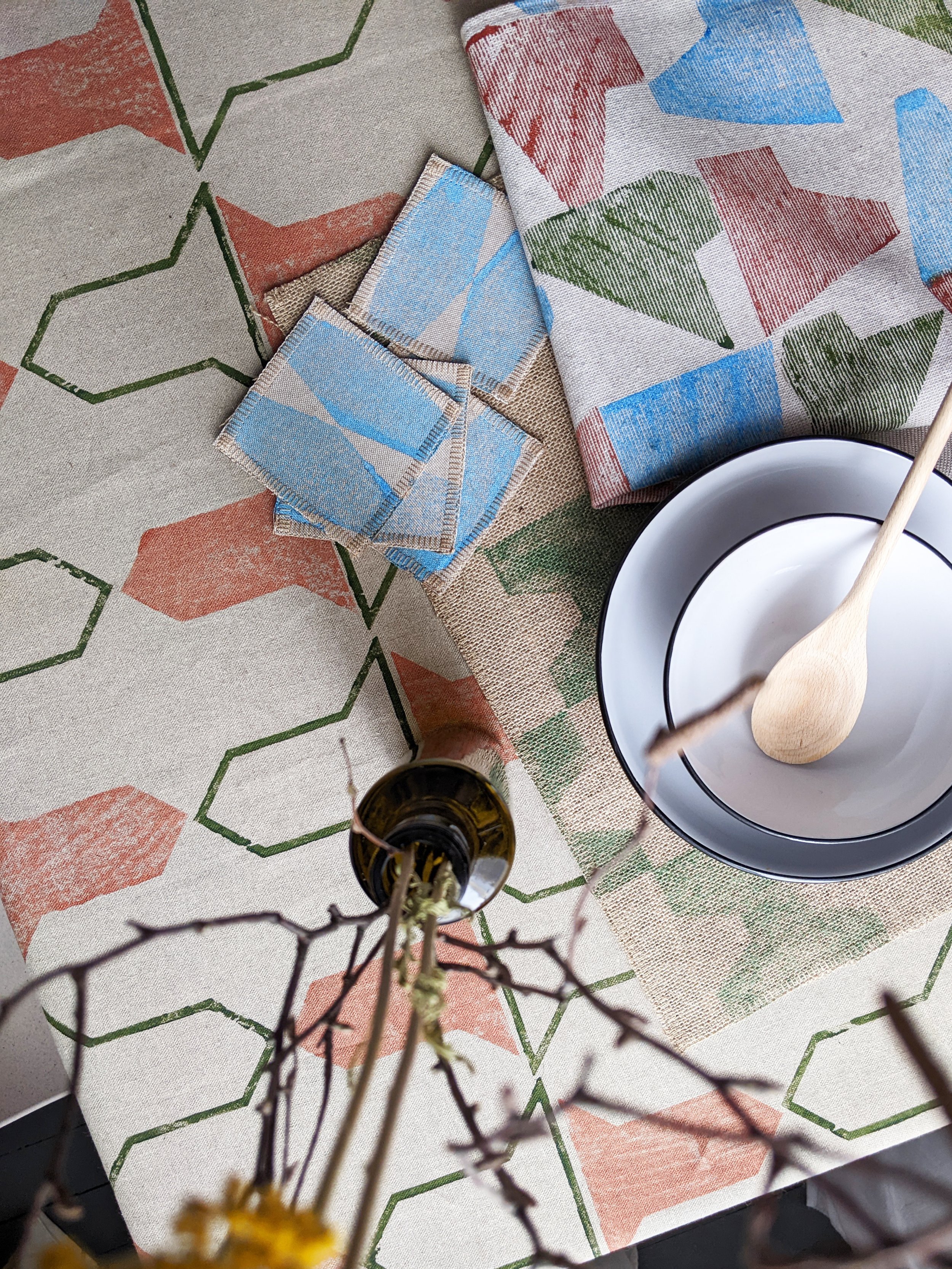 kitchen table with rustic textiles in natural colours and geometric prints