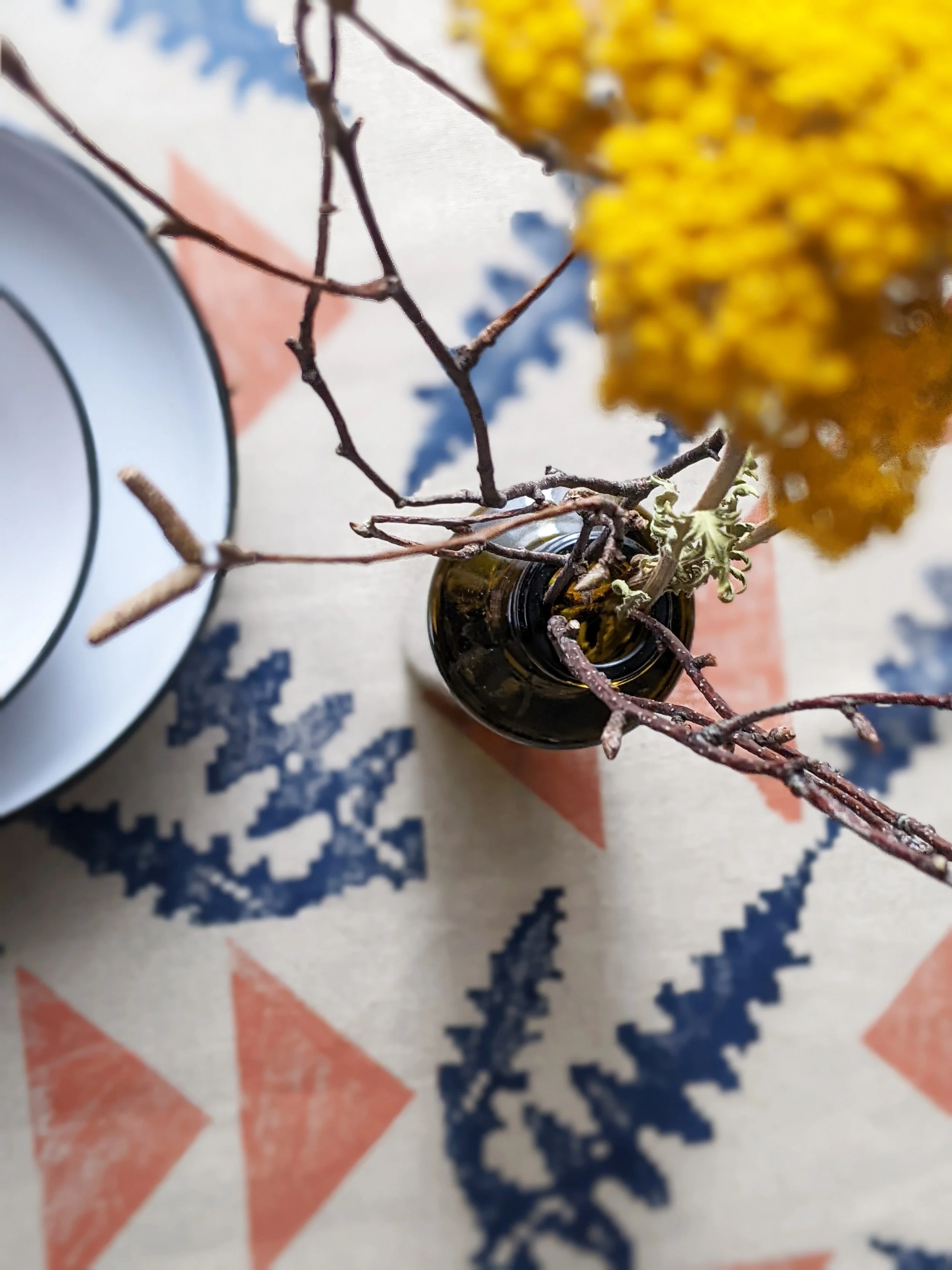 rustic table scene with botanical print on linen runner