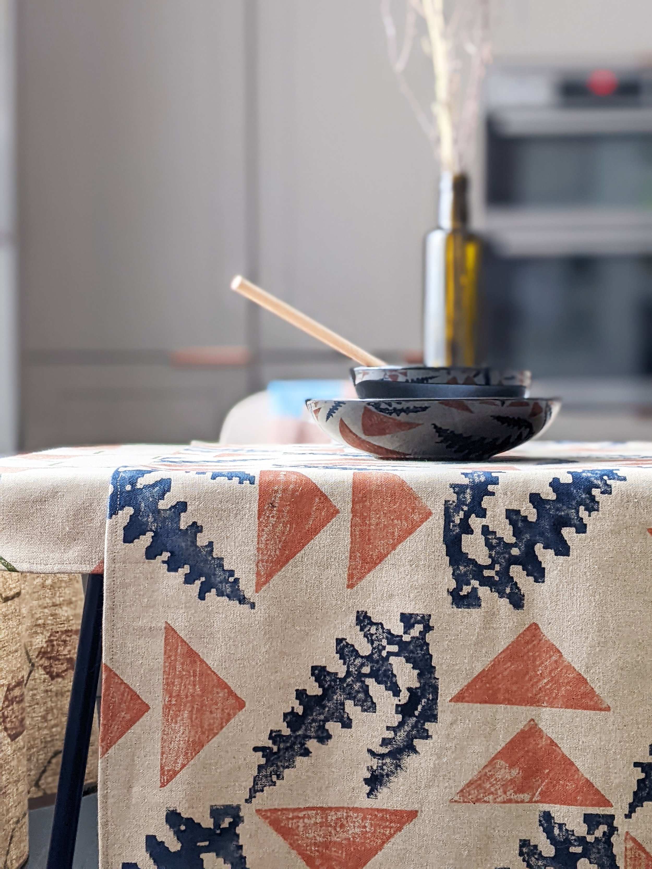 kitchen table with recycled linen runner in botanical print