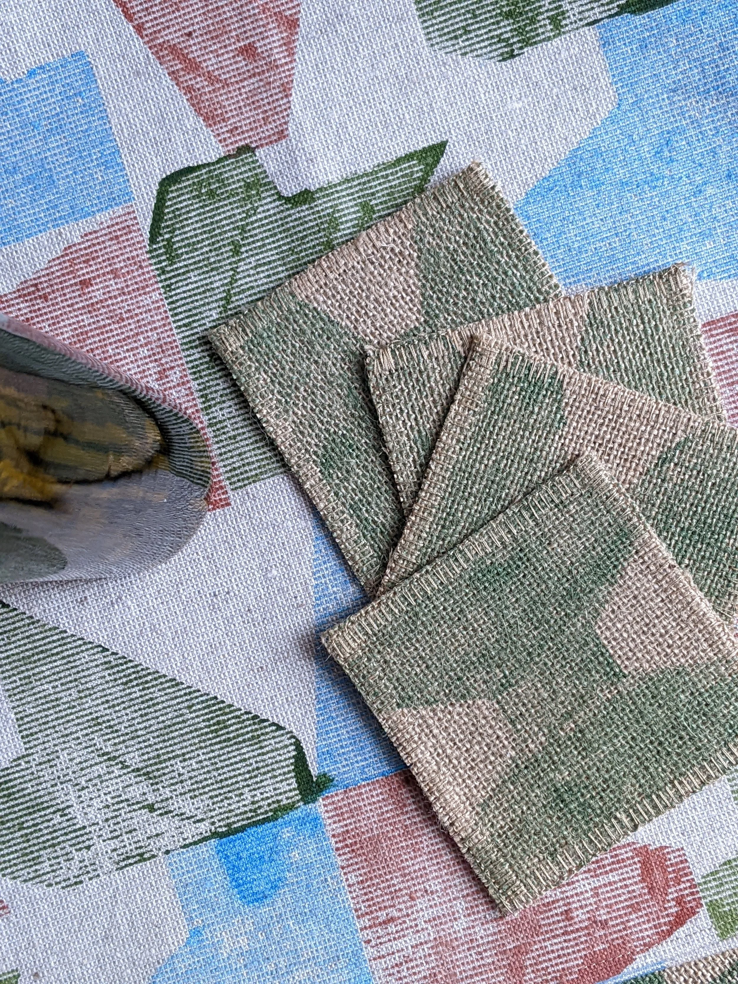 set of jute coasters on rustic table decor
