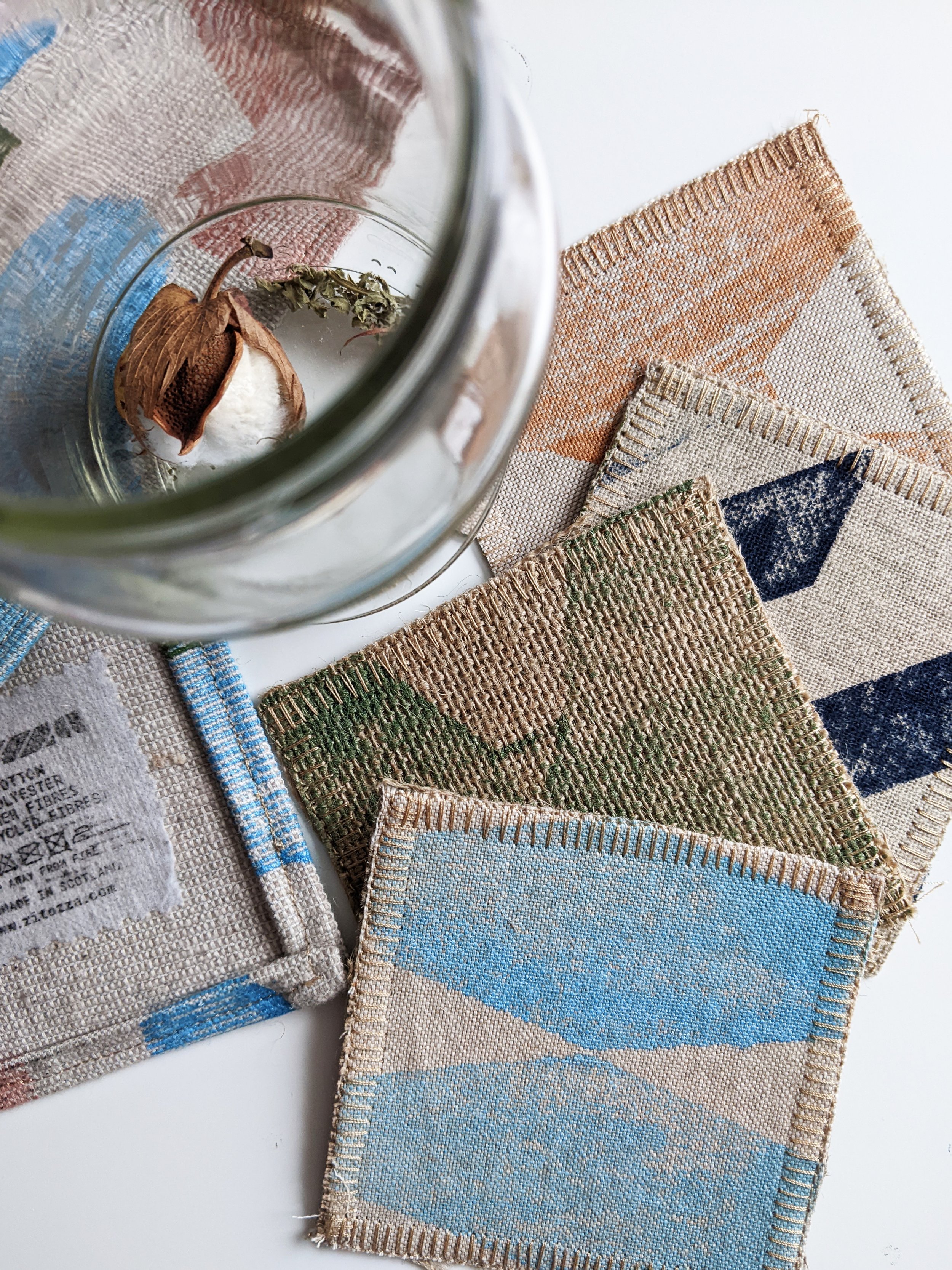 assortment of textile coasters in earth tones