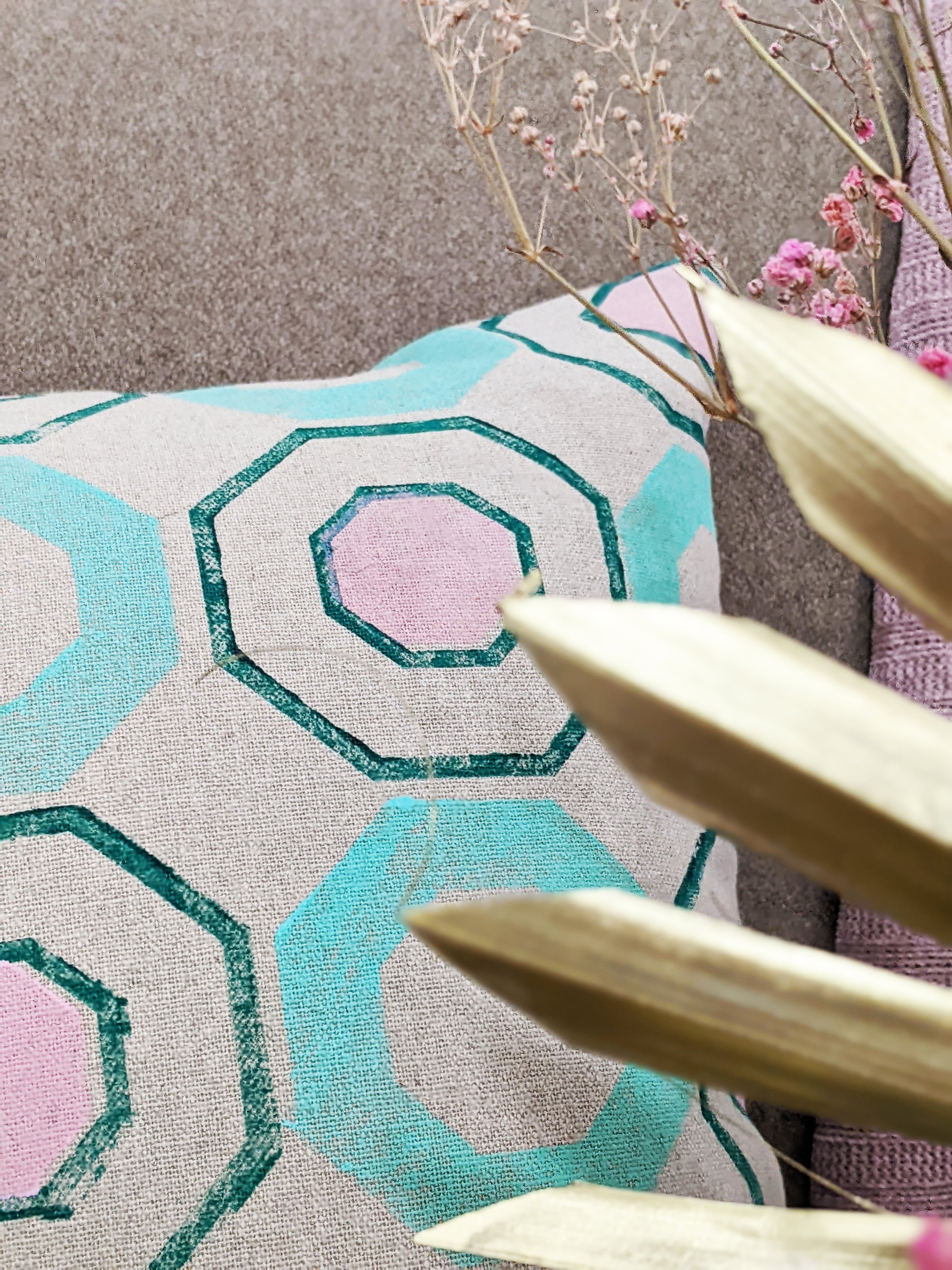 close-up detail of block printed geometric pattern on recycled linen cushion