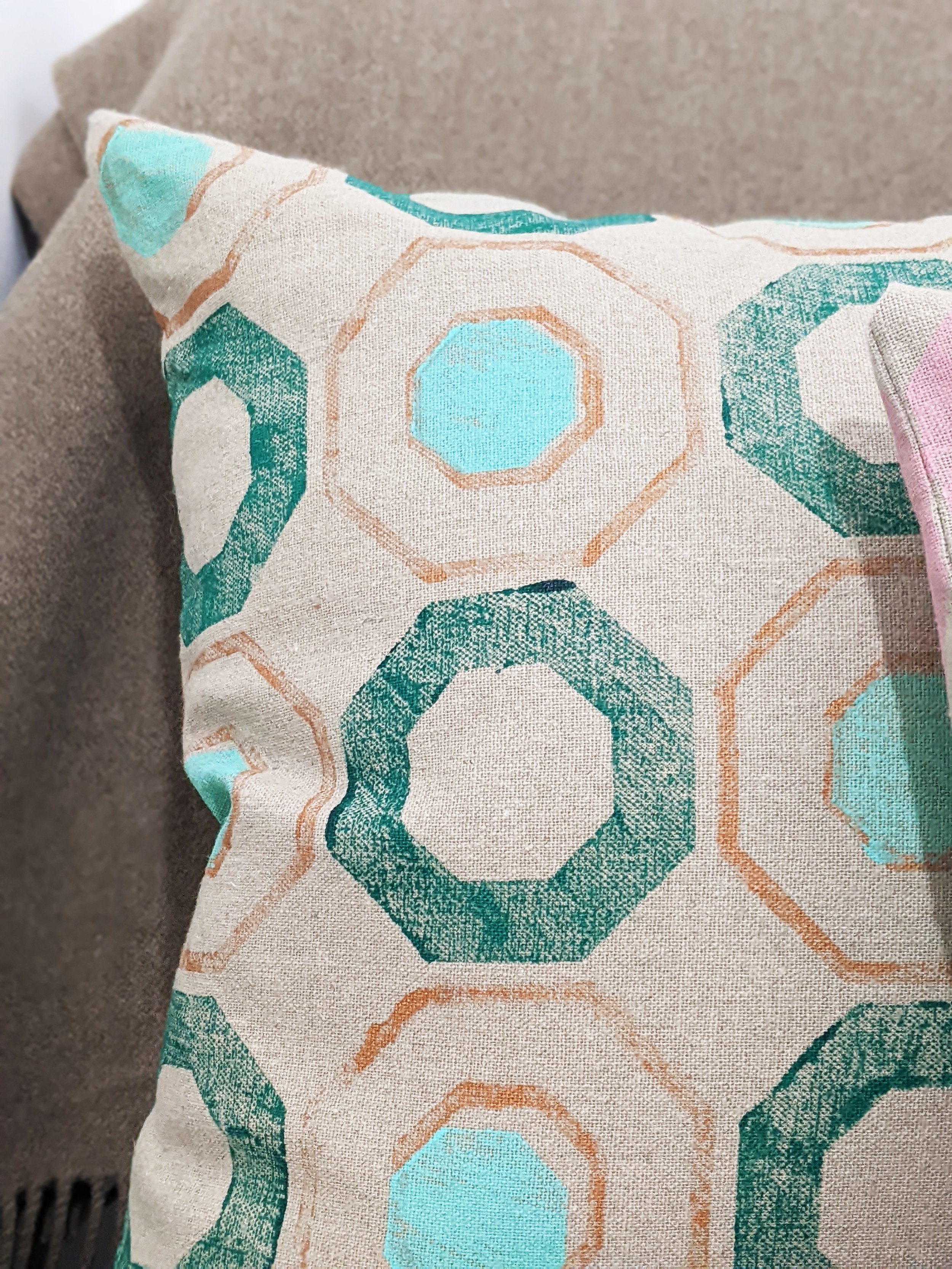 geometric green print on linen cushion in hand block printed finish