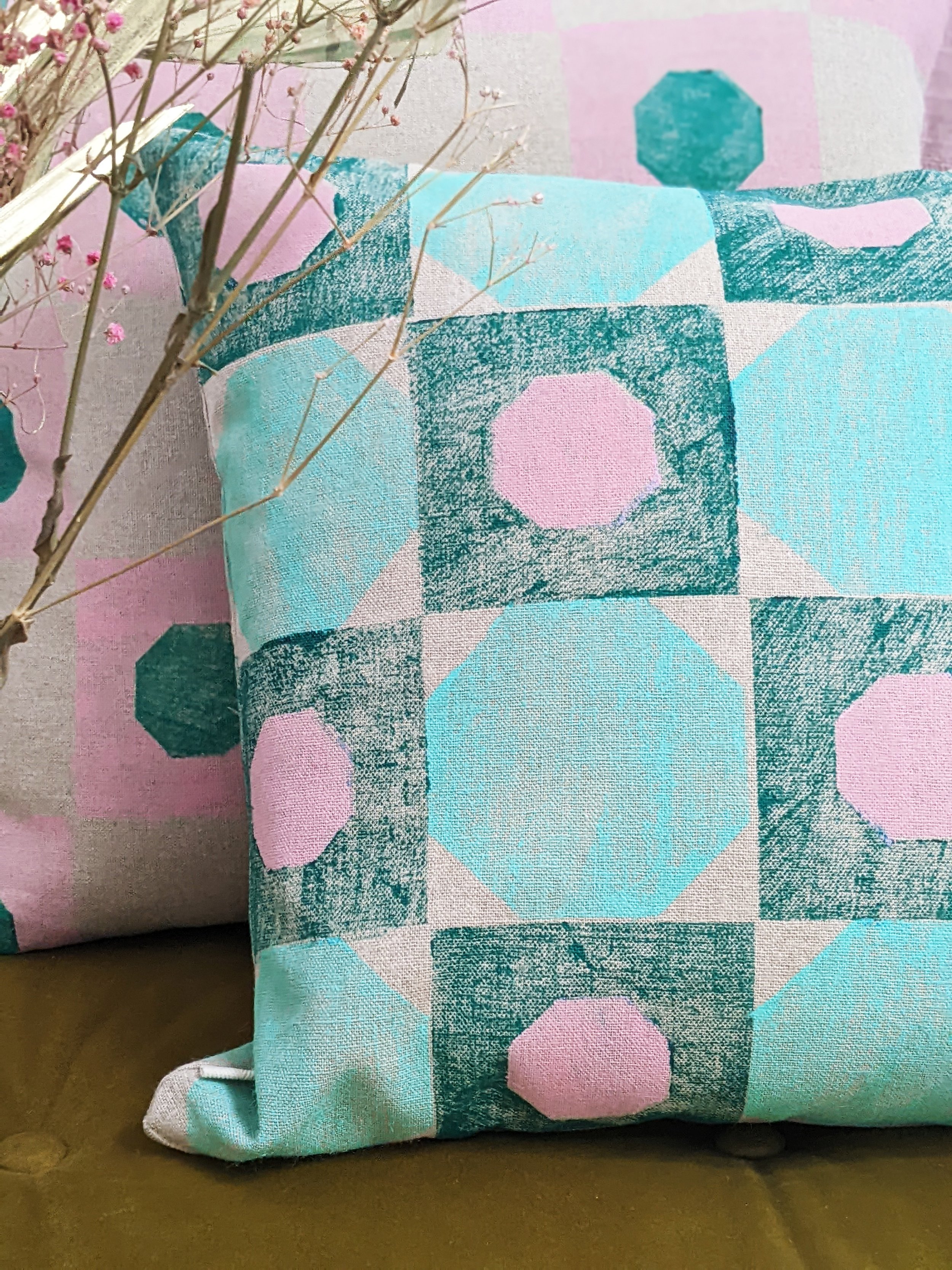 hand block printed geometric print on square cushion in mint green colours