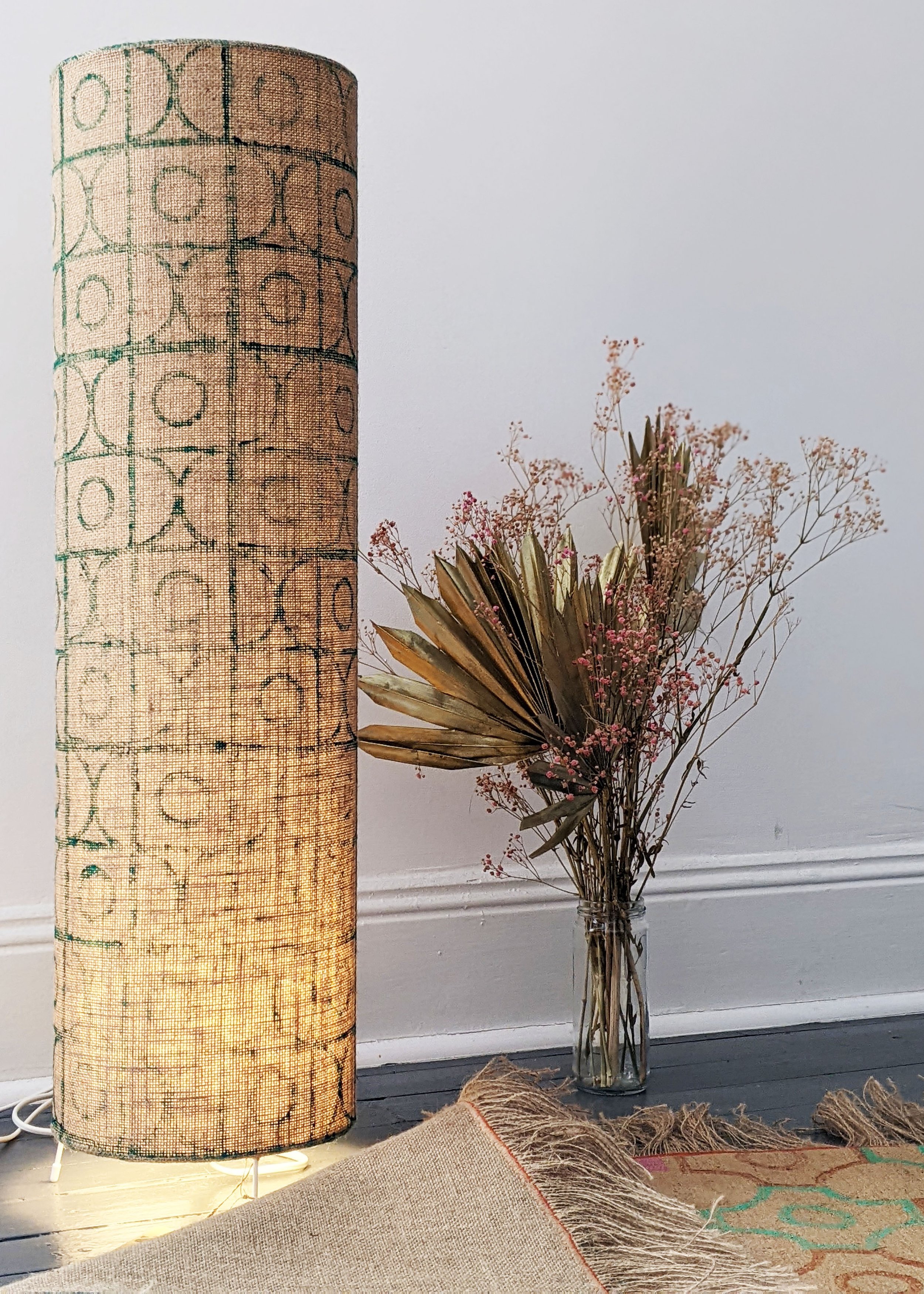 interior with rustic block printed floor lamp illuminated
