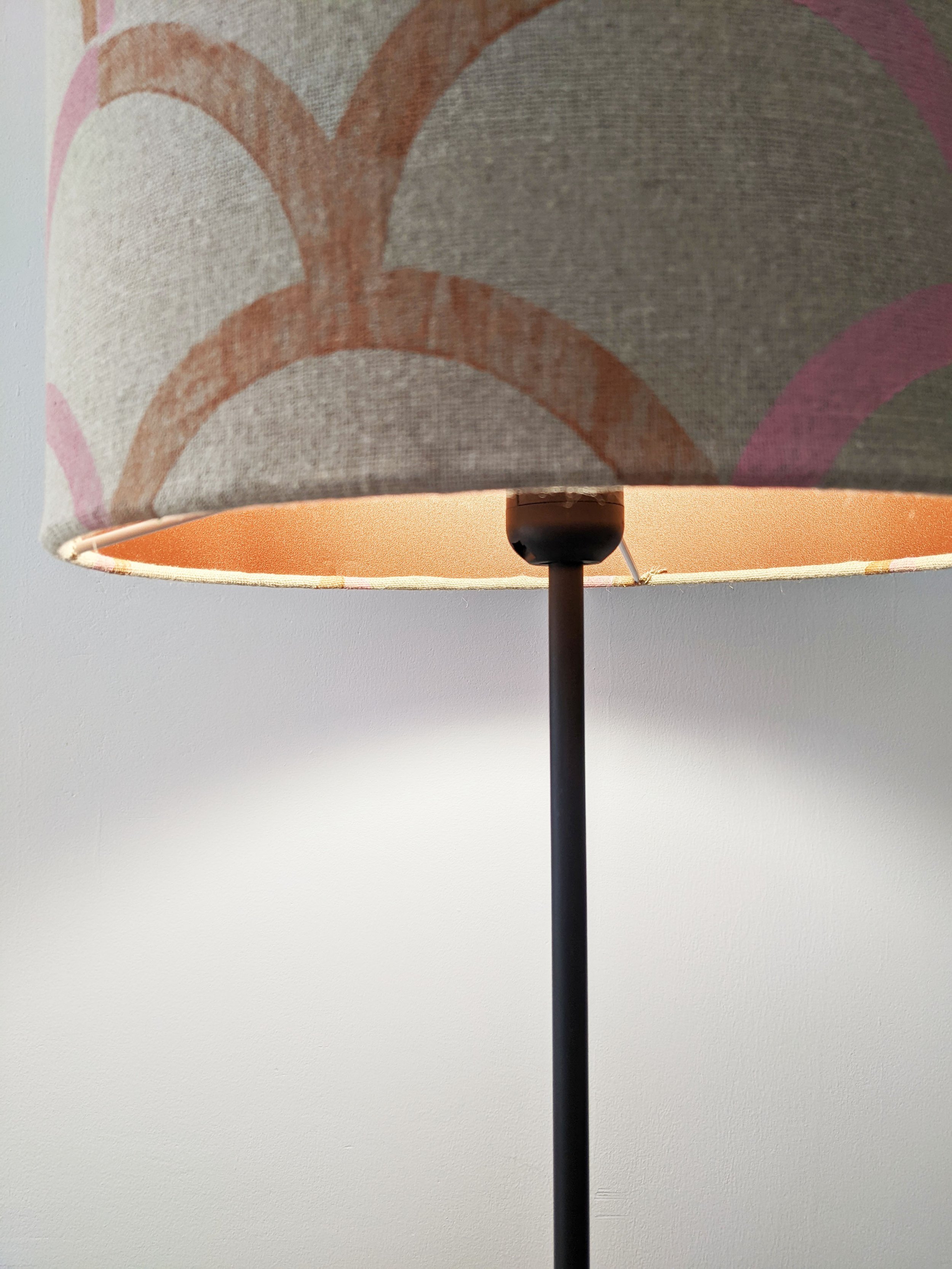 bronze lampshade reflecting light with luxury textile cover with vintage pastel print