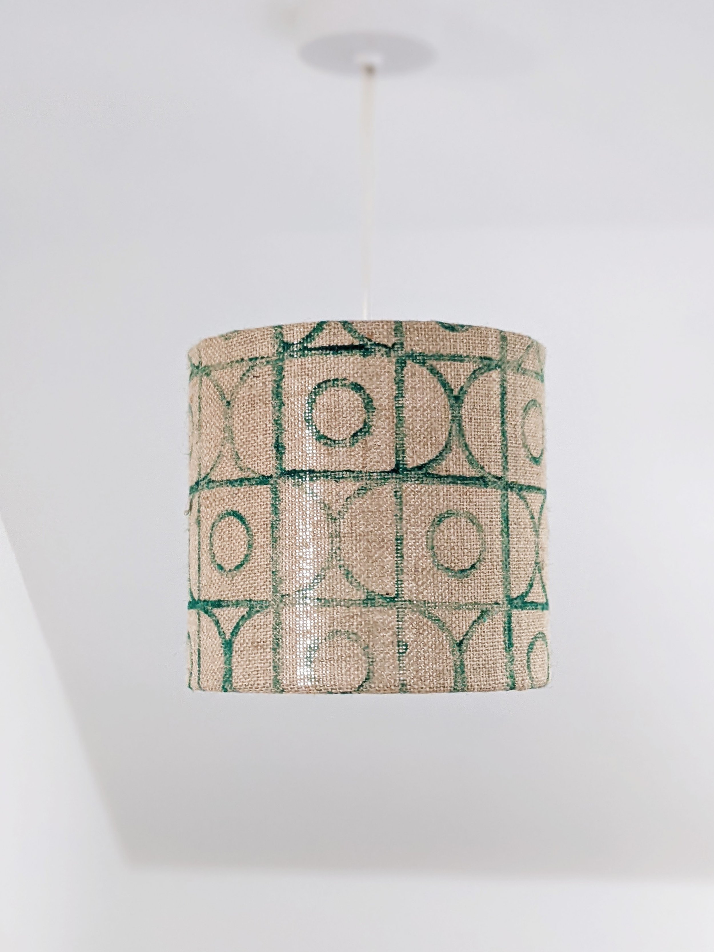 small drum lampshade with hand block printed, deco inspired print on jute