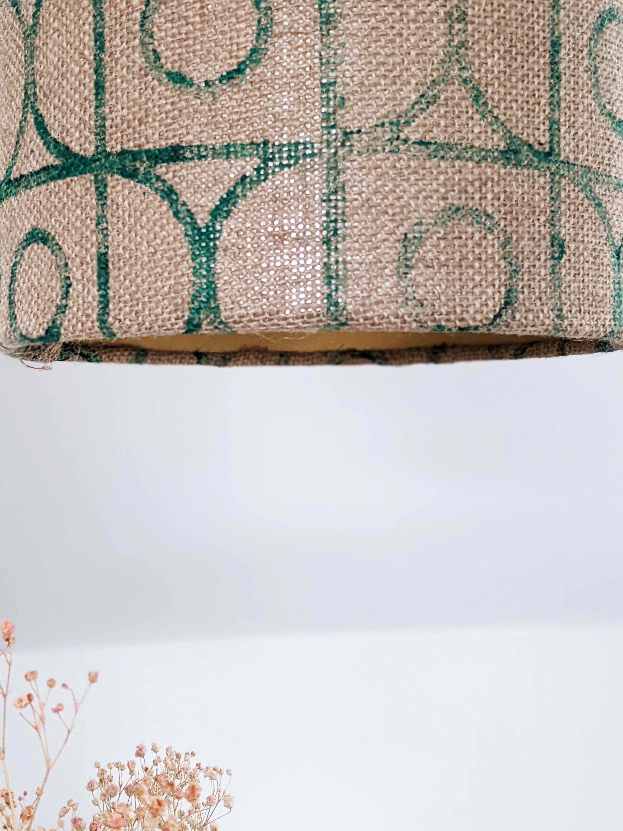 hand block printed vintage-inspired deco pattern on gold lined lamp