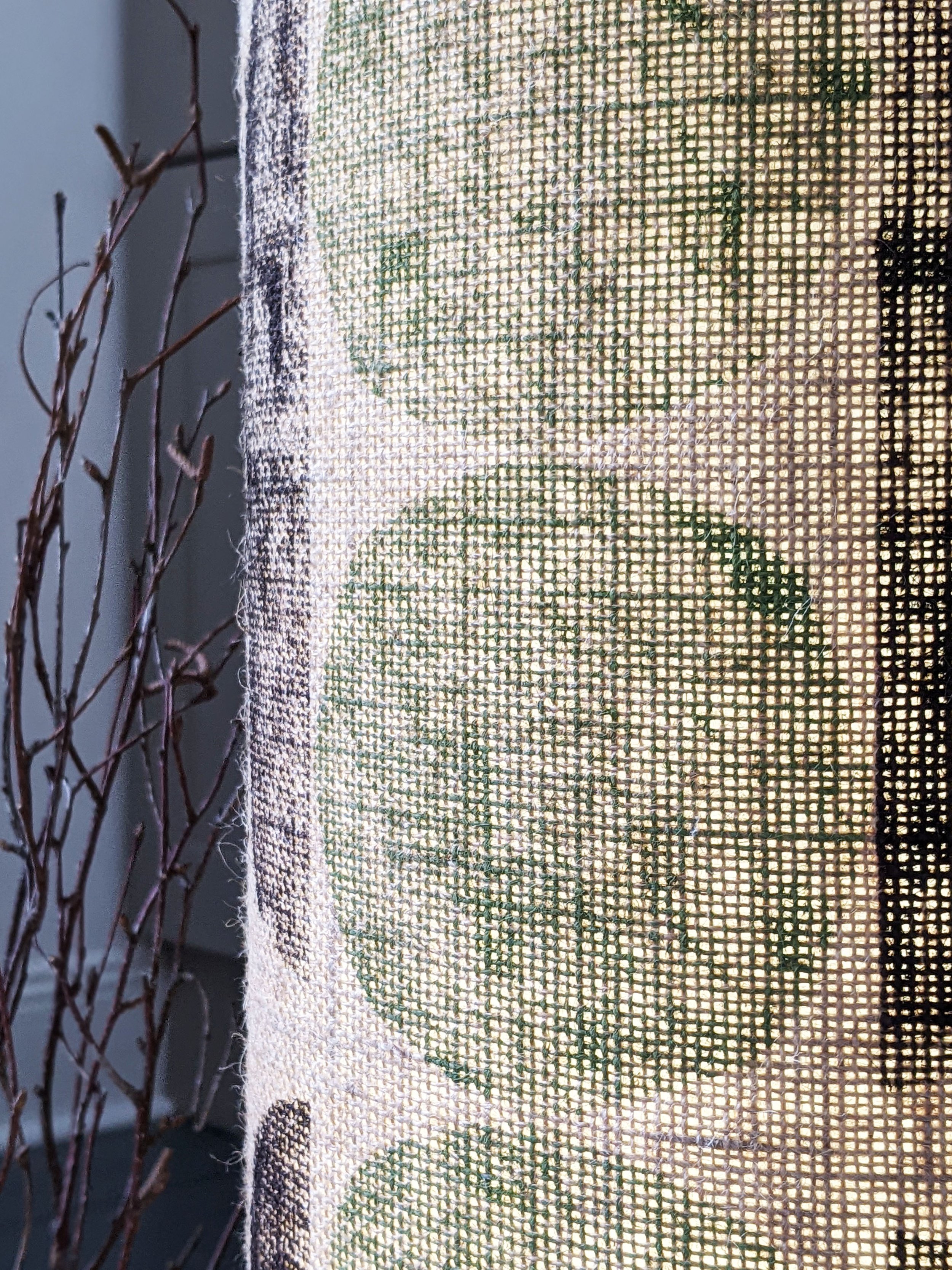 detail of green and brown geometric print on hessian lamp