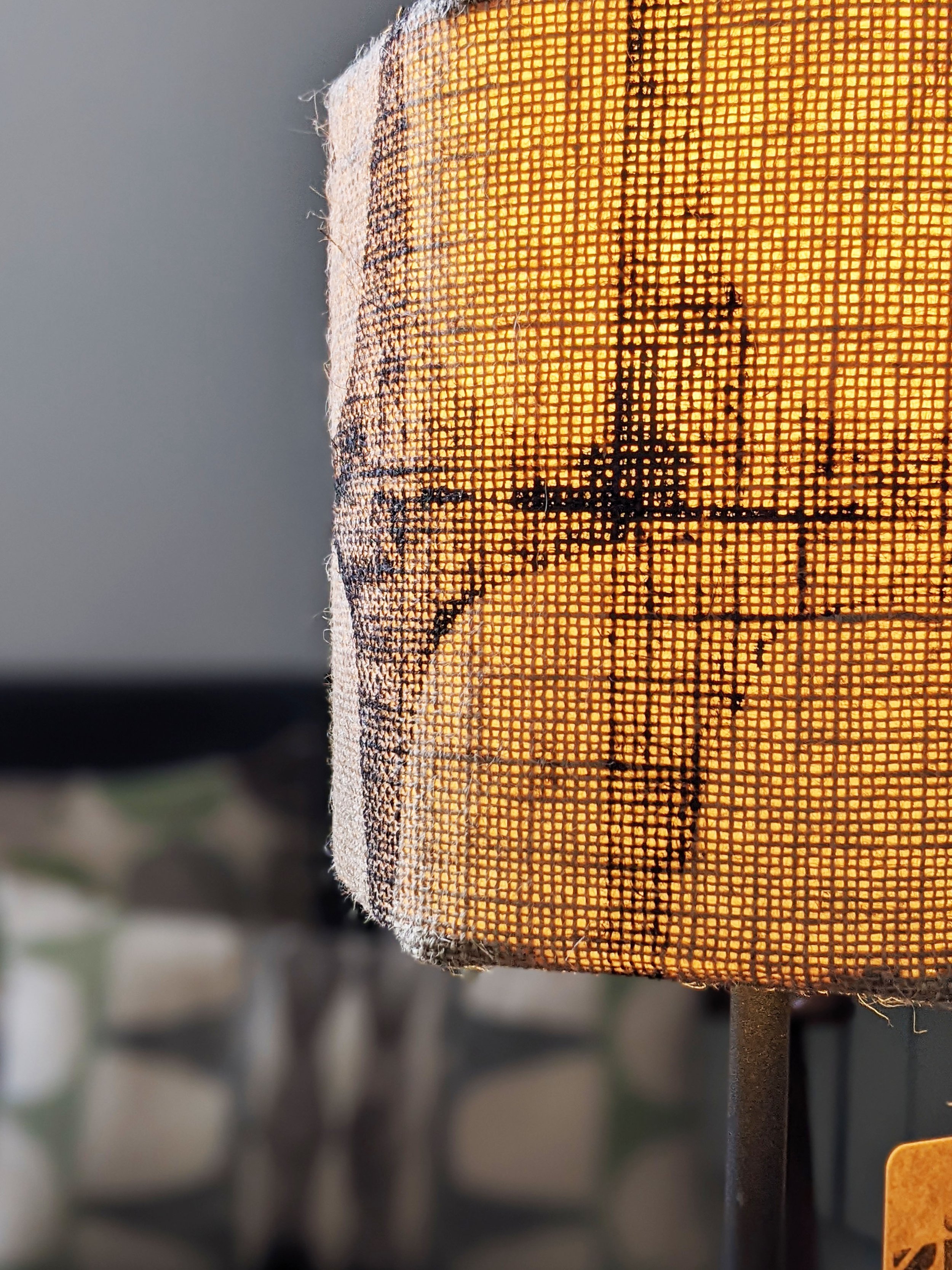 close-up detail of hexagonal jute lampshade with brutalism-inspired pattern