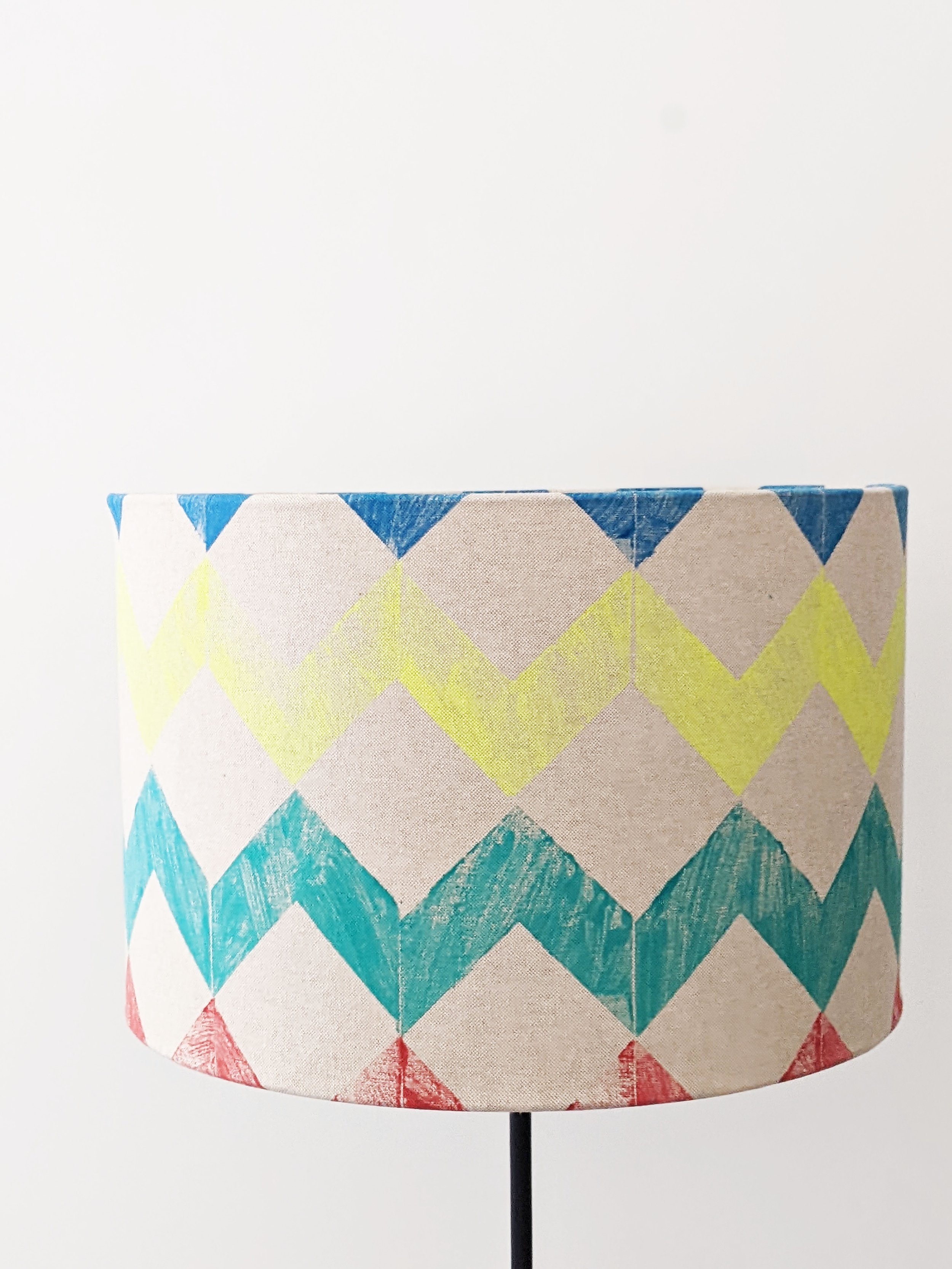 large drum lampshade with bright, bold colourful zig-zag stripes