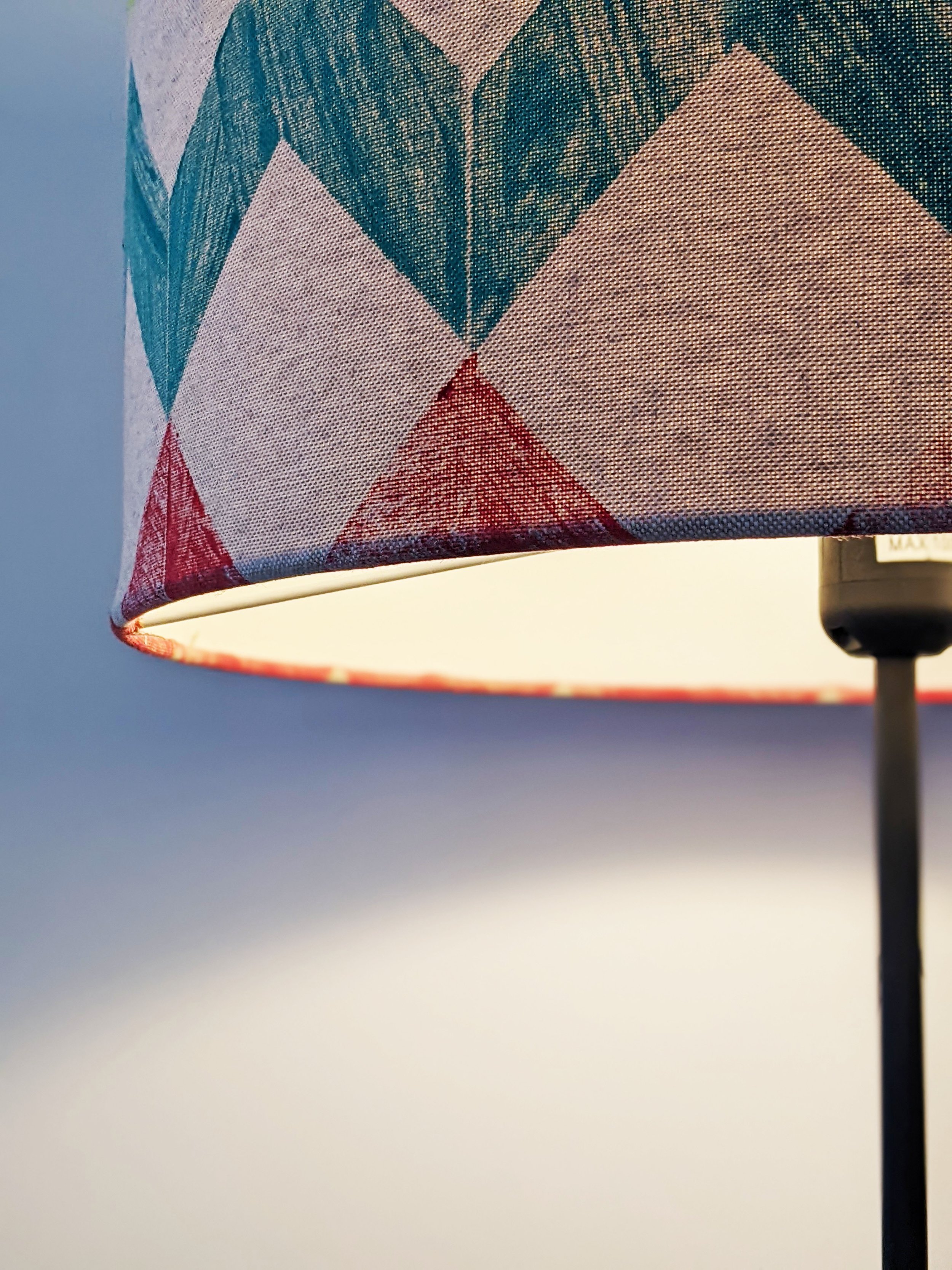 close-up detail of hand block printed fabric covered large drum lampshade